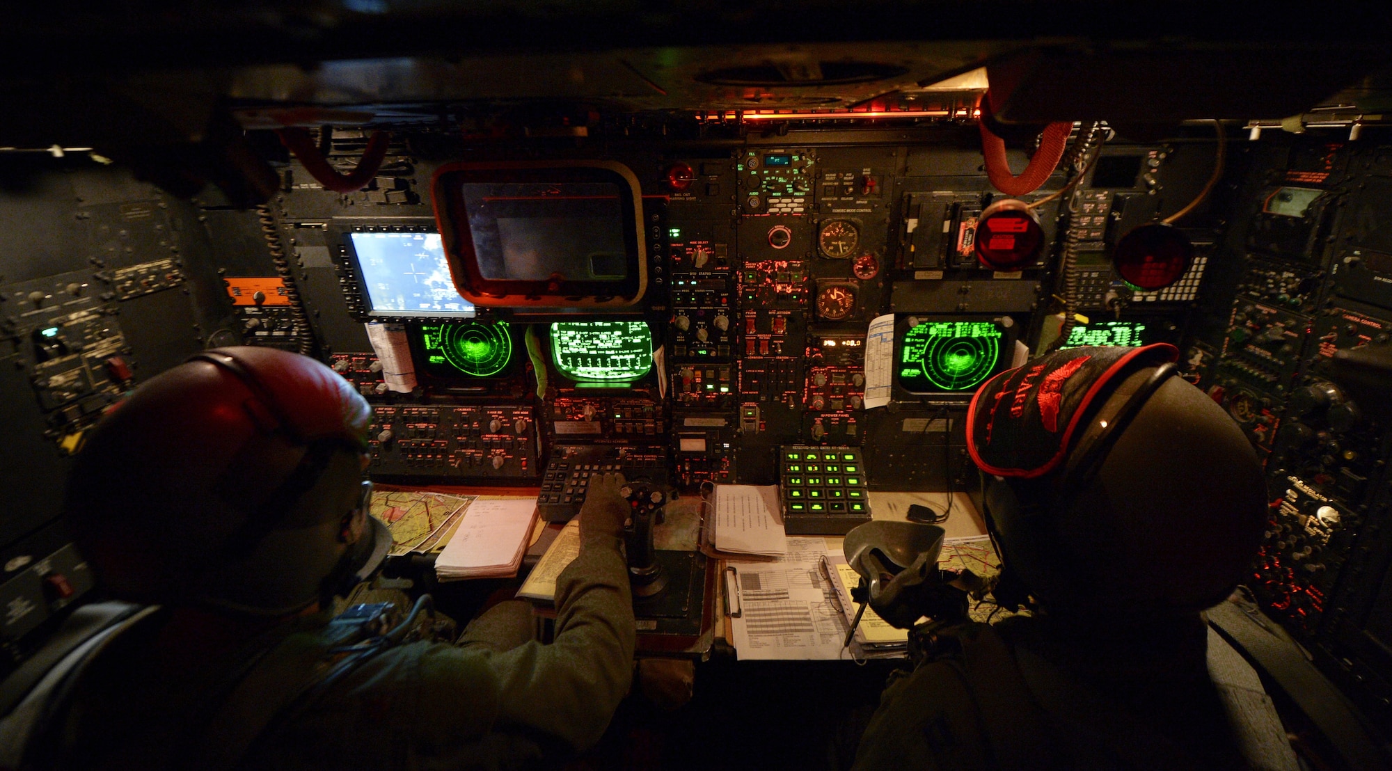 Maj. Chris Weir, left, and Capt. Greg Lepper, right, 96th Bomb Squadron B-52H Stratofortress navigators, navigate a B-52 during a Green Flag-East training mission over Fort Polk, La., Aug. 21, 2013. GF-E is a realistic air-land integration combat training exercise meant to replicate deployed warfare conditions. Leppper's hometown is Orange County, Calif. and Weir's hometown is Tyler, Texas. (U.S. Air Force photo/Staff Sgt. Jonathan Snyder)
