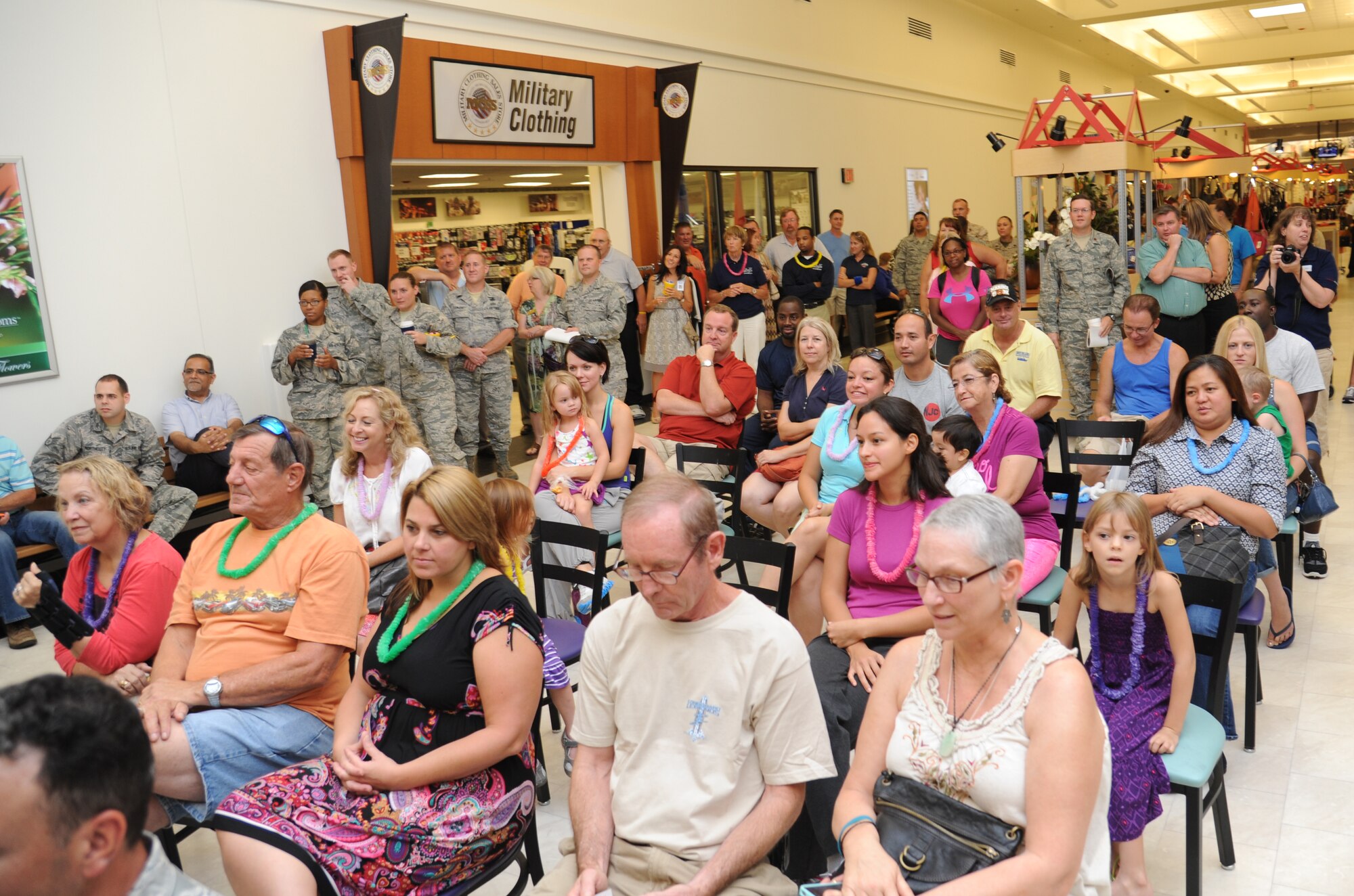 Keesler personnel attend the Information, Tickets and Travel kiosk ribbon cutting ceremony Aug. 22, 2013, at the base exchange, Keesler Air Force Base, Miss. The kiosk is part of a test at six bases for the next year. (U.S. Air Force photo by Kemberly Groue)