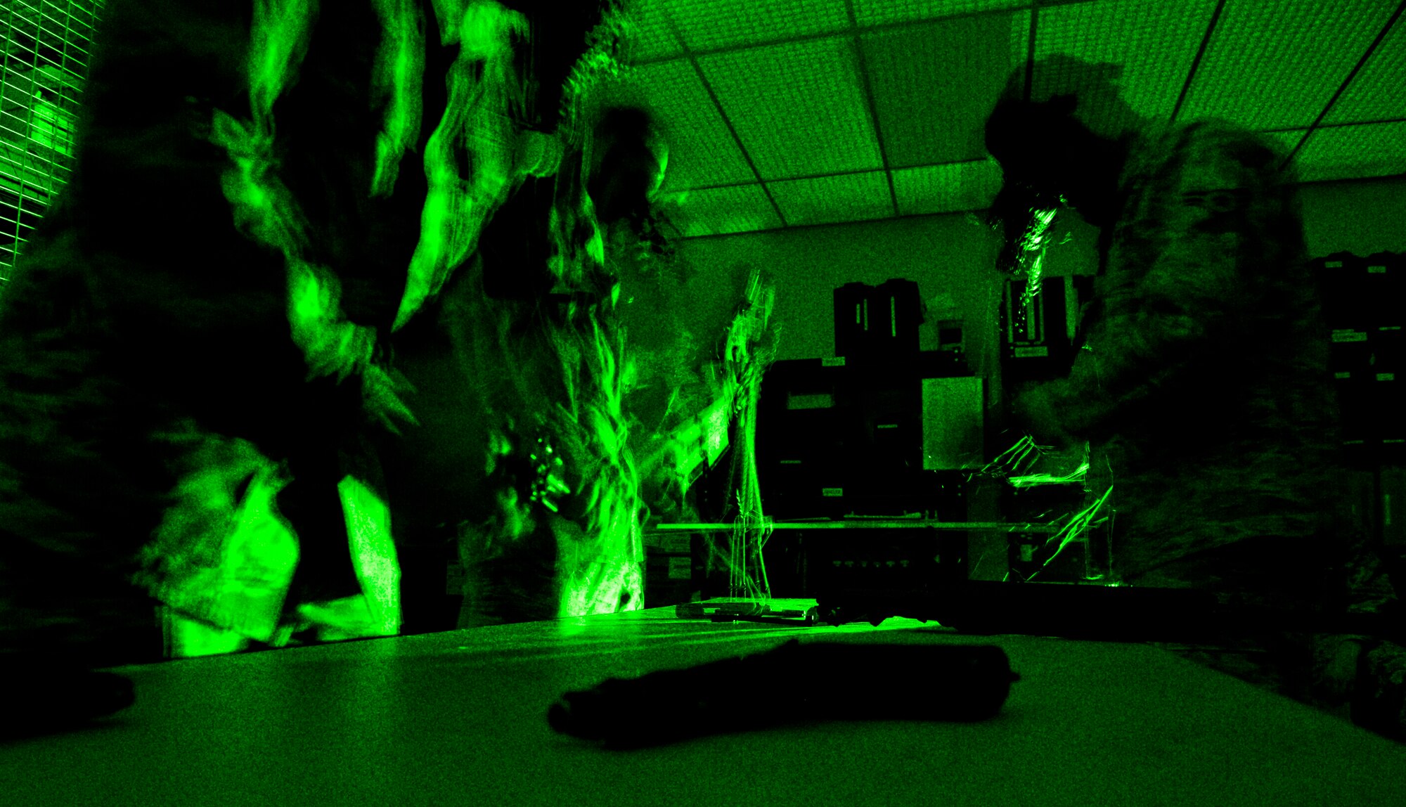 U.S. Air Force Airmen assemble M-16 rifles and an M-9 with Night Vision Goggles Aug. 15, 2013, at Mountain Home Air Force Base, Idaho. Participants said this event was one of the hardest events in the engineers challenge causing a team to get zero points in this event.  (U.S. Air Force photo simulation by Airman 1st Class Brittany A. Chase/released)
