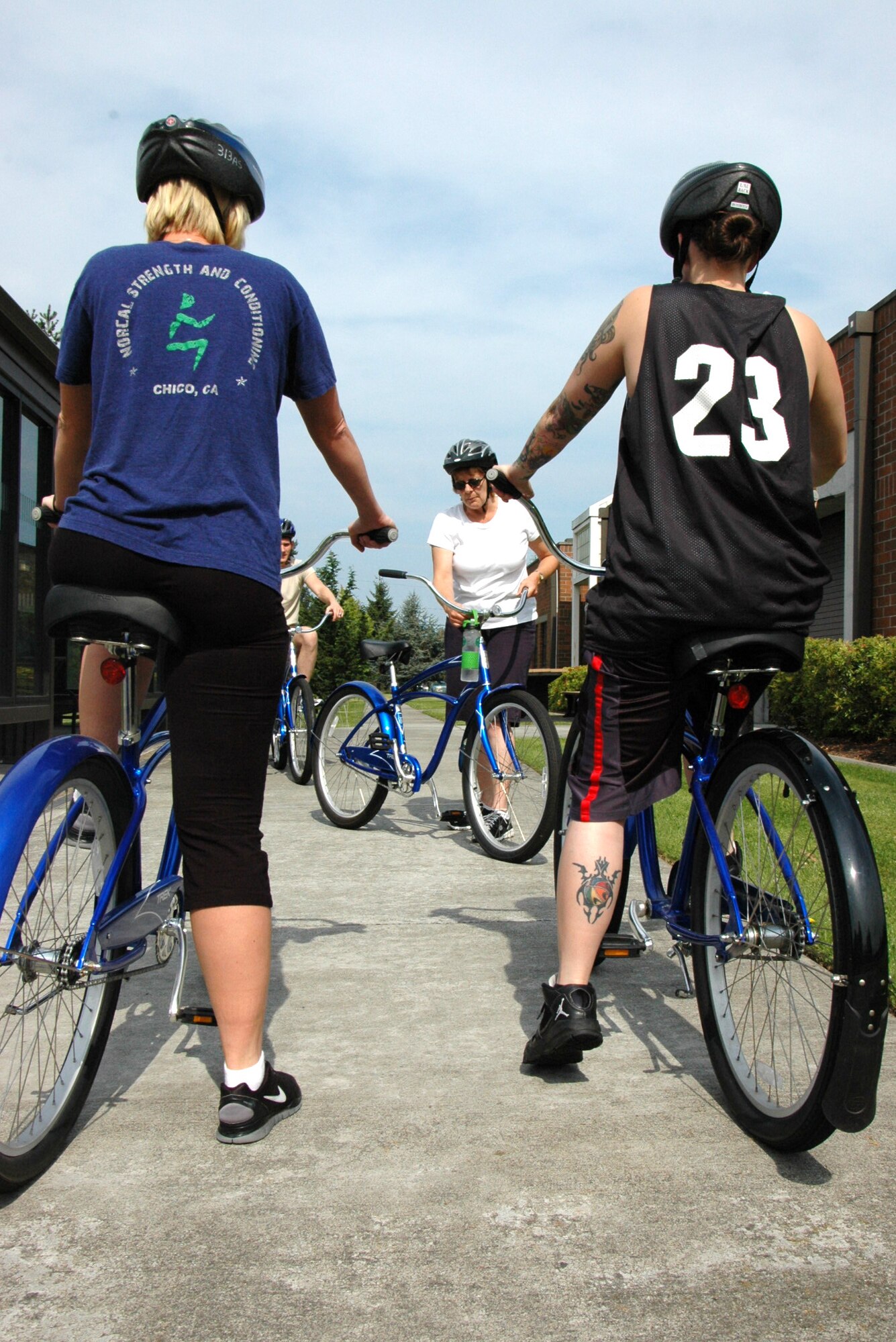 Senior Master Sgt. Liz Milligan, center, uses the blue bike program about three times a week. Milligan, 446th Operations Support Flight, is usually joined by three or four of her fellow Reservists. (U.S. Air Force Reserve photo by Sandra Pishner)
