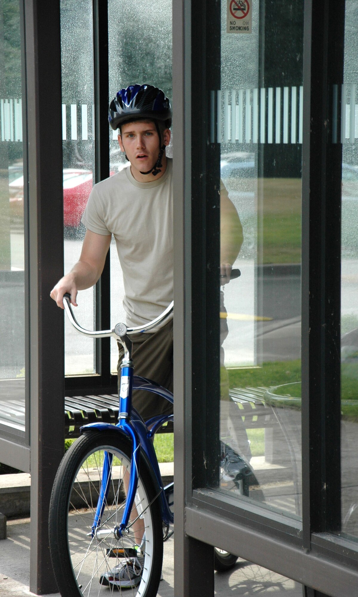 Senior Airman Jeffrey Lowery, 446th Operations Support Flight, prepares to head out on a ride on a bike from the McChord Blue Bike Program. (U.S. Air Force Reserve photo by Sandra Pishner)