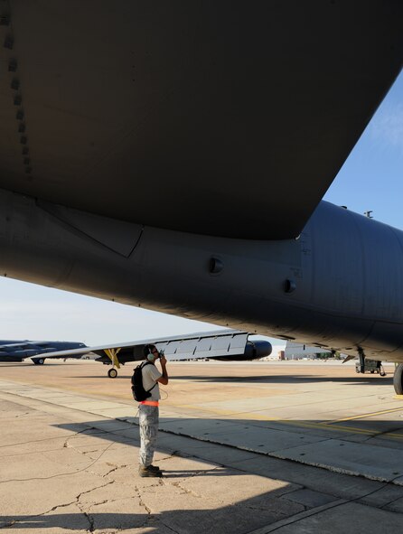 Senior Airman Dylan Gaissert, 96th Aircraft Maintenance Unit crew chief, inspects the rudder and elevator of a B-52H Stratofortress on Barksdale Air Force Base, La., Aug. 21, 2013. The rudder and elevator are two flight control surfaces which control the flight dynamics on the aircraft. Flight dynamics are the external forces during flight that affect the aircraft speed and altitude. (U.S. Air Force photo/Senior Airman Benjamin Gonsier)