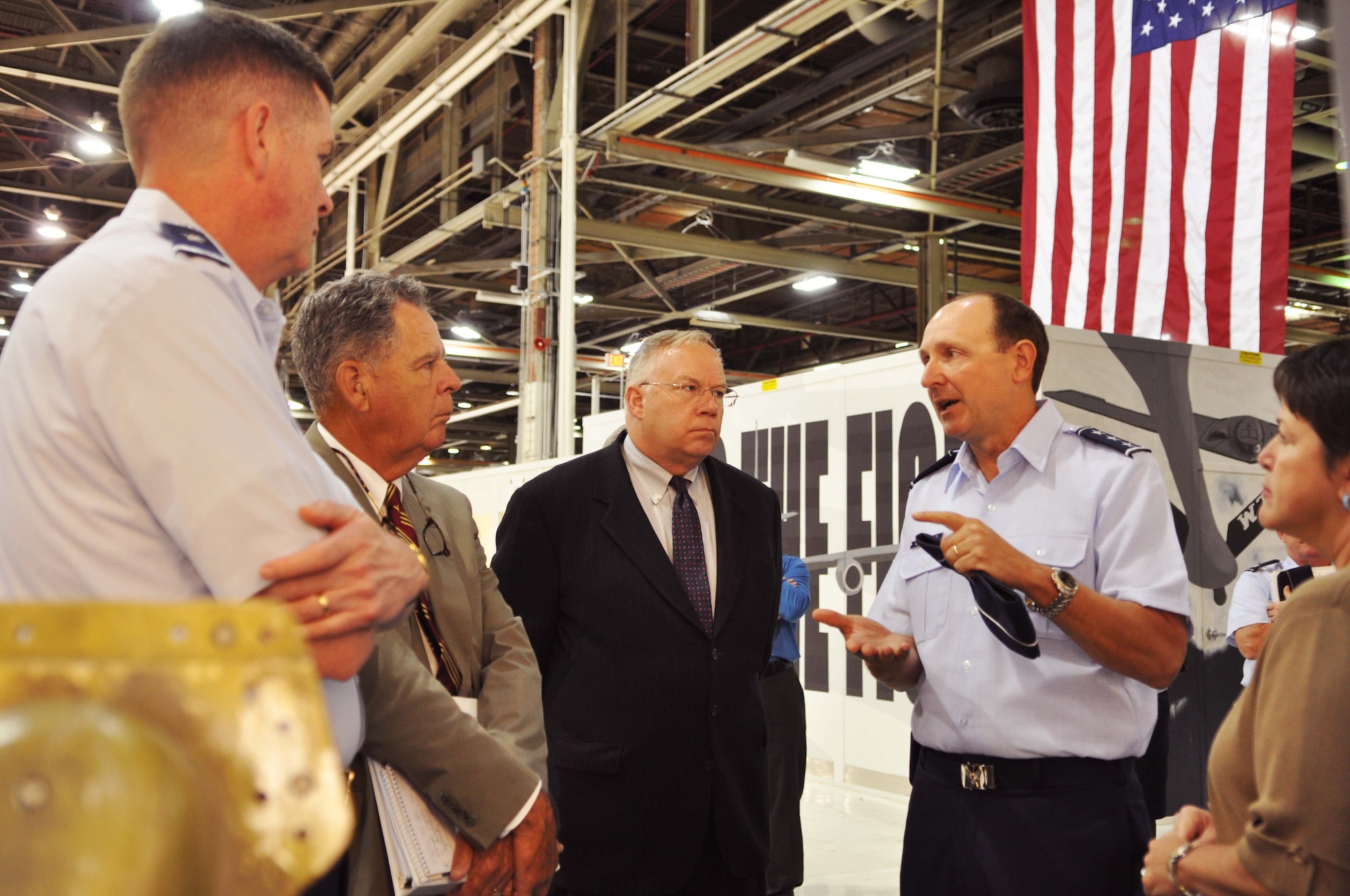 Air Force photo by Micah Garbarino
From right, Lt. Gen. Bruce Litchfield, Air Force Sustainment Center commander, explains a KC-135 production chart to Dr. James Blackwell Jr. and retired Marine Lt. Gen. Dennis McCarthy as Oklahoma City Air Logistics Complex Commander, Brig. Gen. Donald Kirkland looks on. Dr. Blackwell is the director and General McCarthy is the chairman of the National Commission on the Structure of the Air Force. The commission visited active duty, Guard and Reserve units at Tinker Monday and Tuesday.   