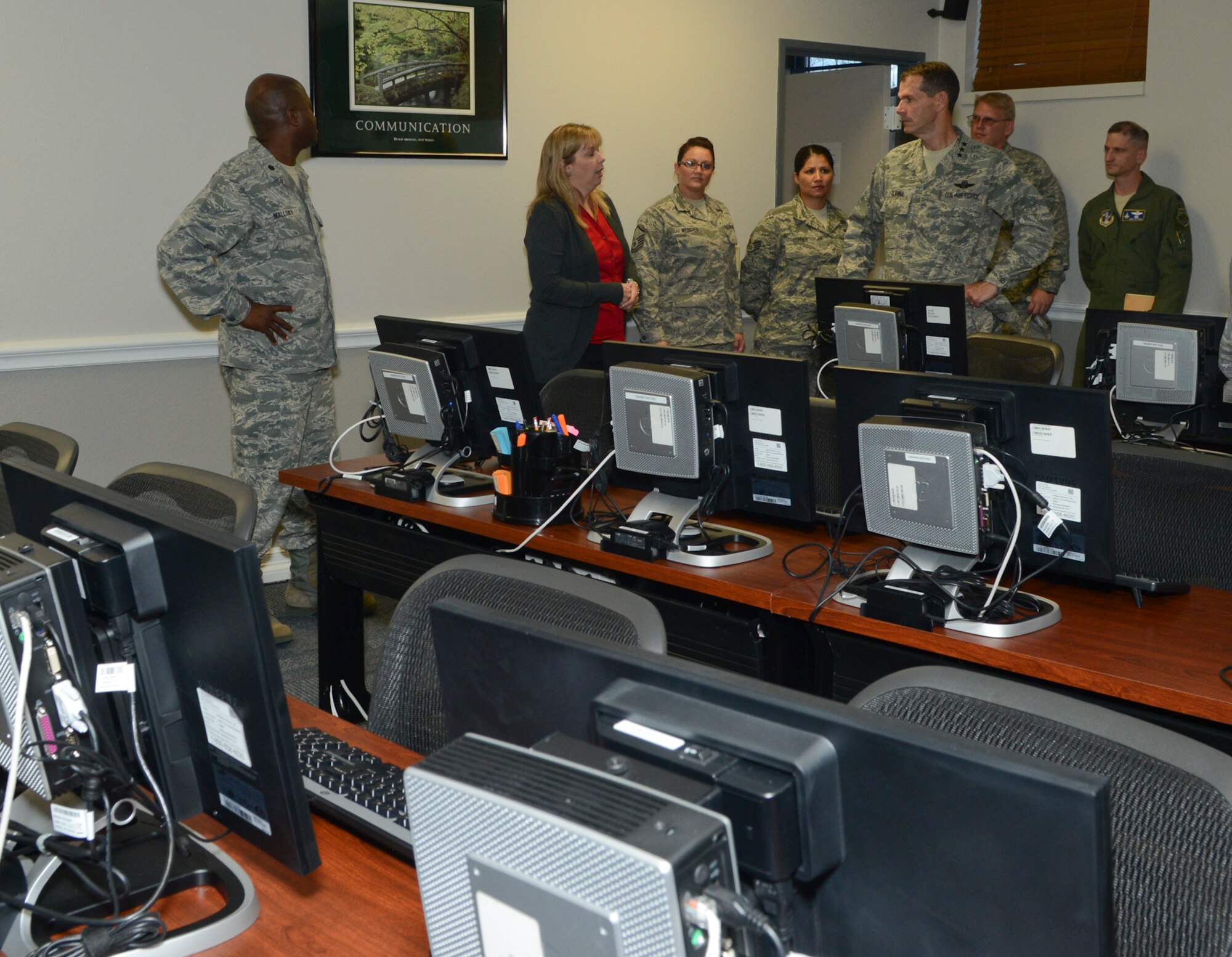 Mrs. Heidi Bearden, Airman and Family Readiness program manager, 136th Airlift Wing, Texas Air National Guard explains to Lt. Gen. Stanley Clarke the importance and impact of the Transition Assistance Program (TAP) for returning veterans after 180-day deployment with no awaiting jobs, during his site visit at Naval Air Station Fort Worth Joint Reserve Base, Aug. 21, 2013. The wing is one of two TAP hubs in the Nation with the other located in Phoenix, Arizona. (Air National Guard photo by Senior Master Sgt. Elizabeth Gilbert/released)
