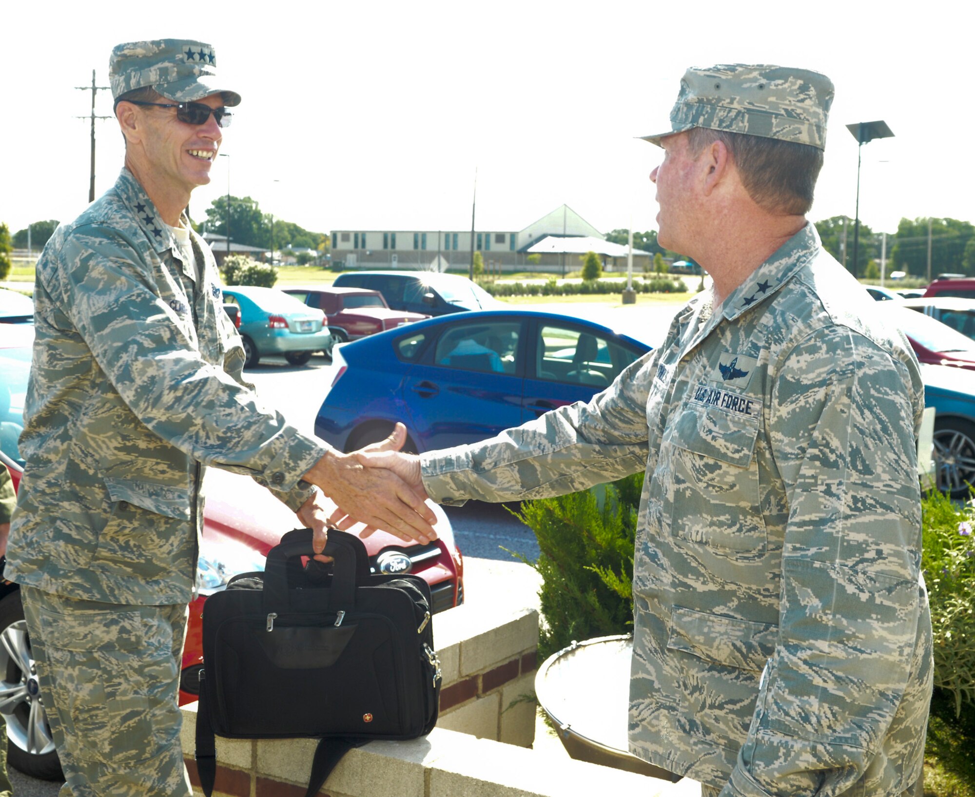 Major Gen. John Nichols, Adjutant General for Texas, greets Lt. Gen. Stanley Clarke, director, Air National Guard during his site visit to the 136th Airlift Wing, Texas Air National Guard at Naval Air Station Fort Worth Joint Reserve Base, Aug. 21, 2013. This is Lt. Gen. Clarke’s first visit to the Wing since his appointment as the director of ANG. (Air National Guard photo by Senior Master Sgt. Elizabeth Gilbert/released)