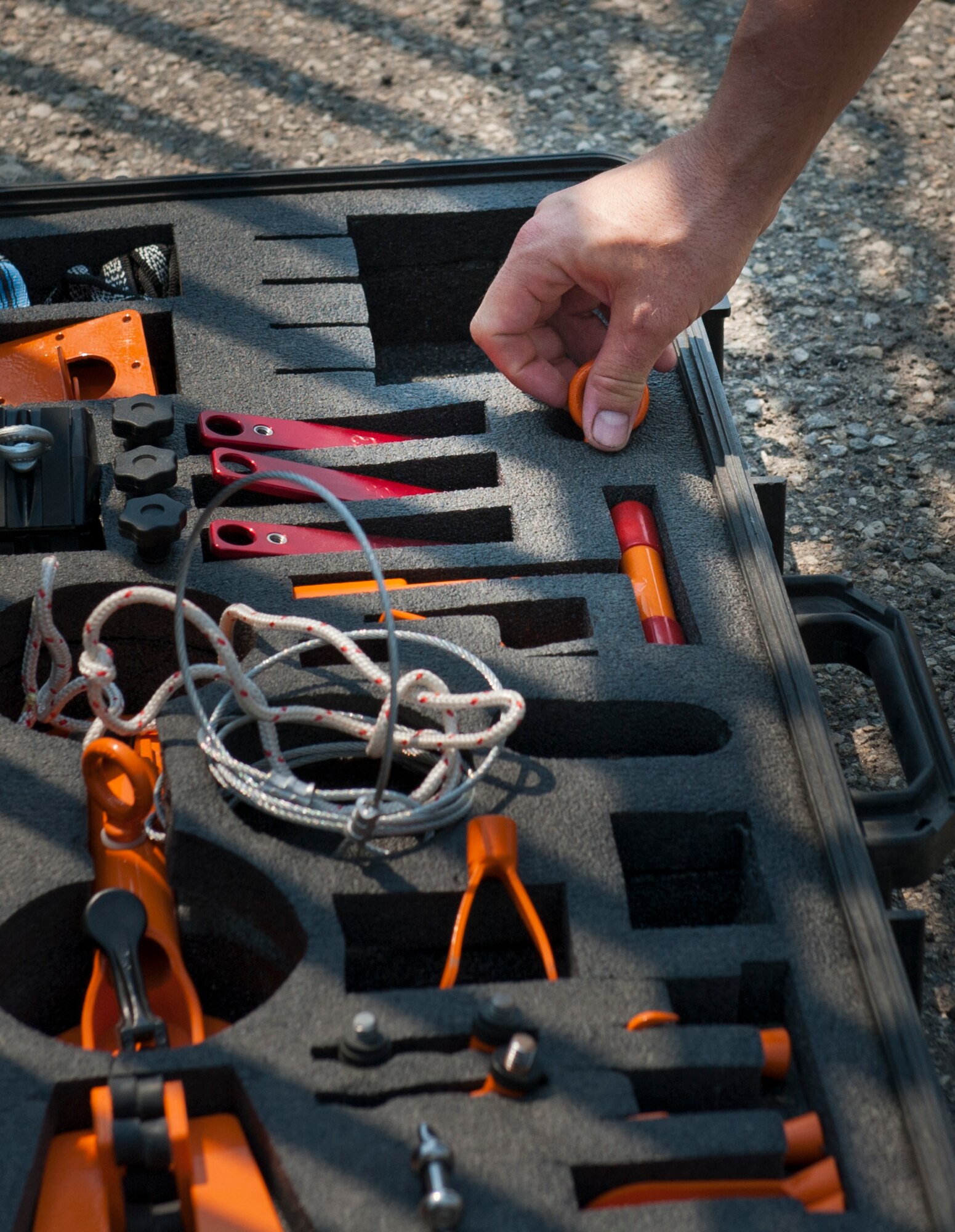 U.S. Air Force Tech. Sgt. Thomas Snell, 366th Civil Engineering Squadron pavement and equipment craftsman, chooses a tool Aug. 15, 2013, at Mountain Home Air Force Base, Idaho. Snell worked with his team to overcome an engineering challenge moving a simulated improvised explosive device. (U.S. Air Force photo by Airman 1st Class Brittany A. Chase/released)