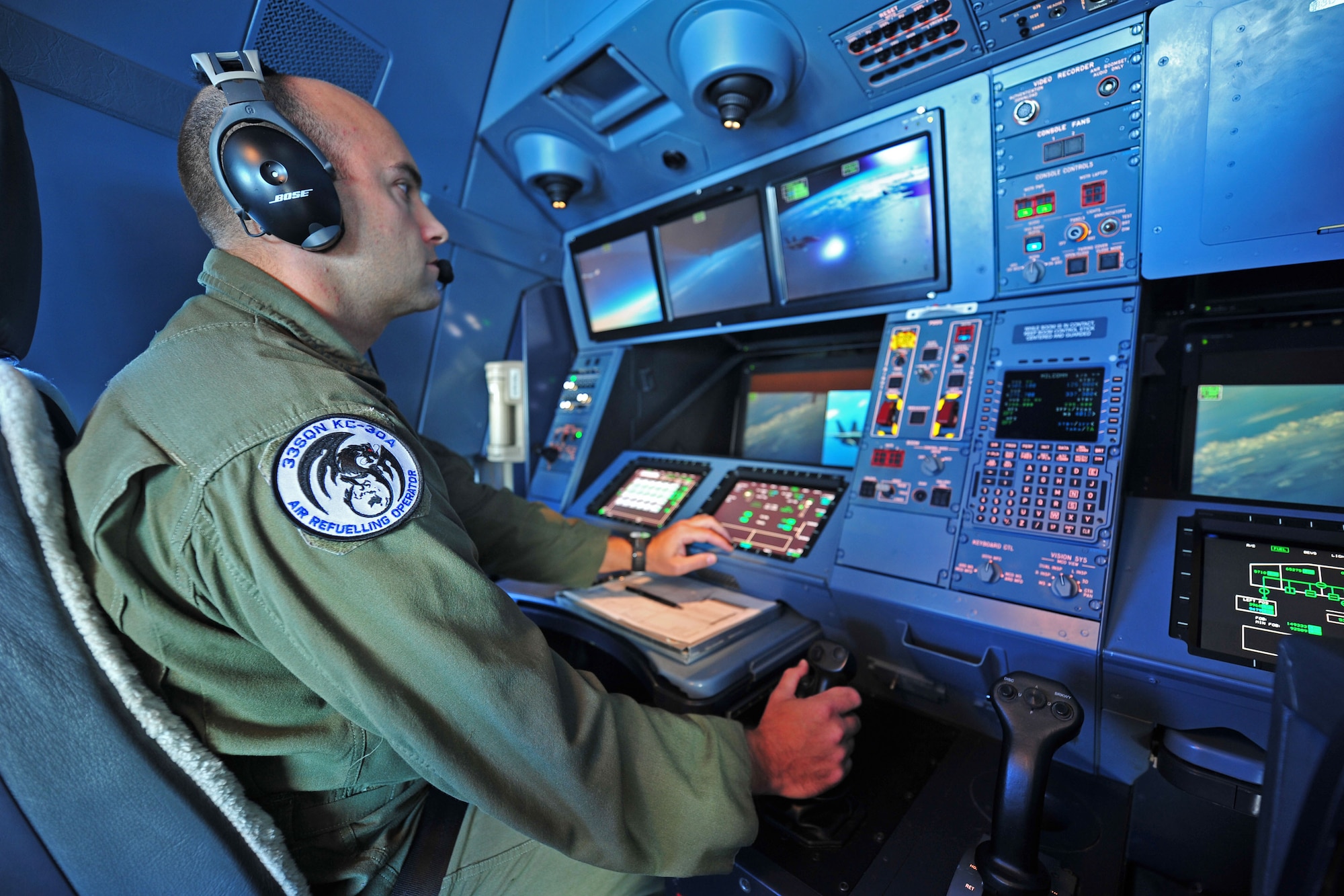 U.S. Air Force Tech Sgt. Lindsay Moon, an aerial refueling operator assigned to No. 33 Squadron, Royal Air Force Base Amberley, operates a refueling pod during a mission off the coast of Queensland, July 26, 2013. The refueling mission was part of Talisman Saber 2013, an exercise that provides realistic, relevant training necessary to maintain regional security, peace and stability. (U.S. Air Force photo by Staff Sgt. Rachelle Coleman)