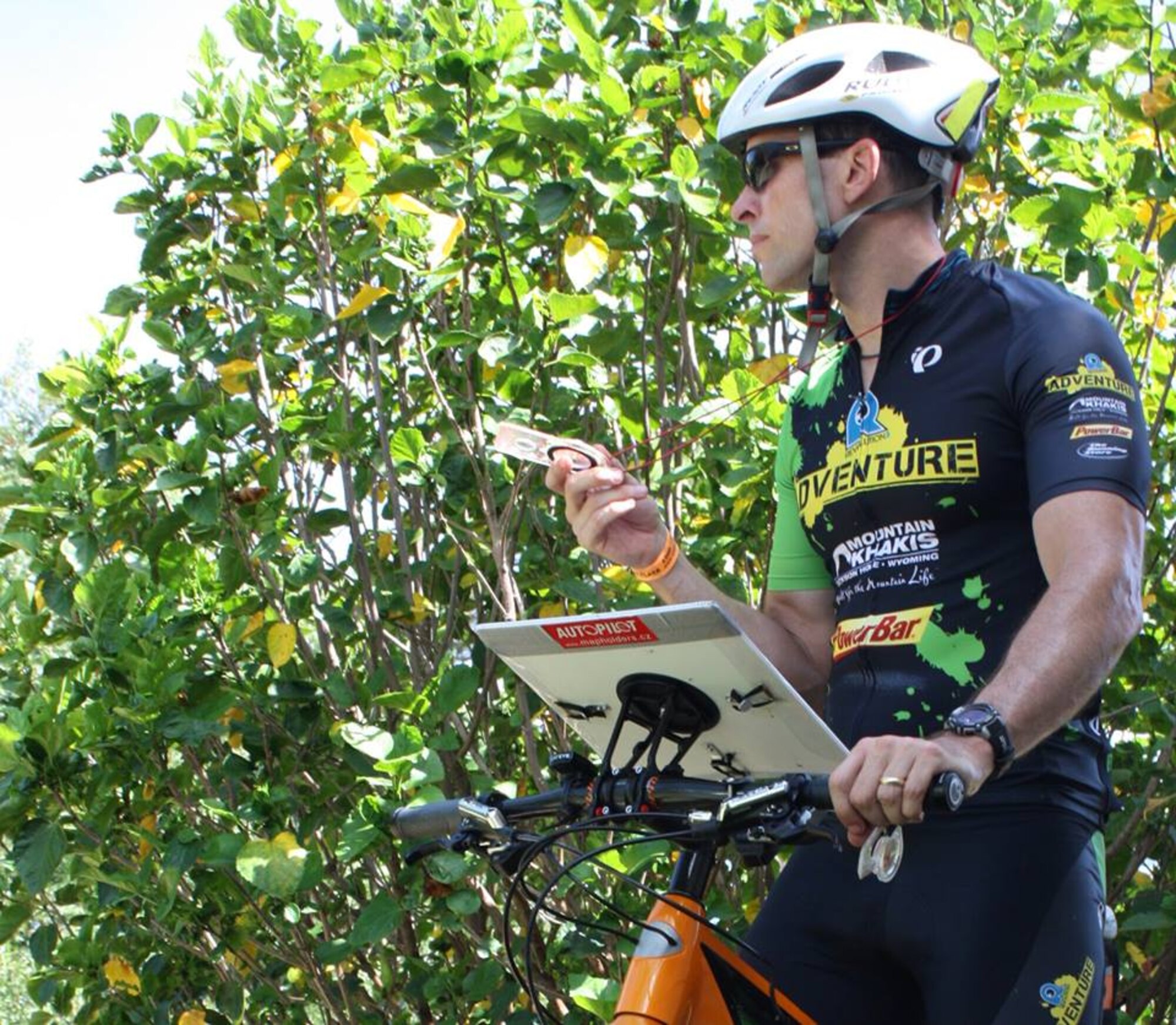 Lt. Col. David "Dash" Ashley positions his compass to look for a checkpoint (control). He will be participating in the 2013 U.S. Elite Mountain Bike Orienteering Team that will represent the U.S. in this summer's 11th annual World Mountain Bike Orienteering Championships in Rakvere, Estonia, Aug. 26-31. (U.S. Air Force Photo/Courtesy Photo)