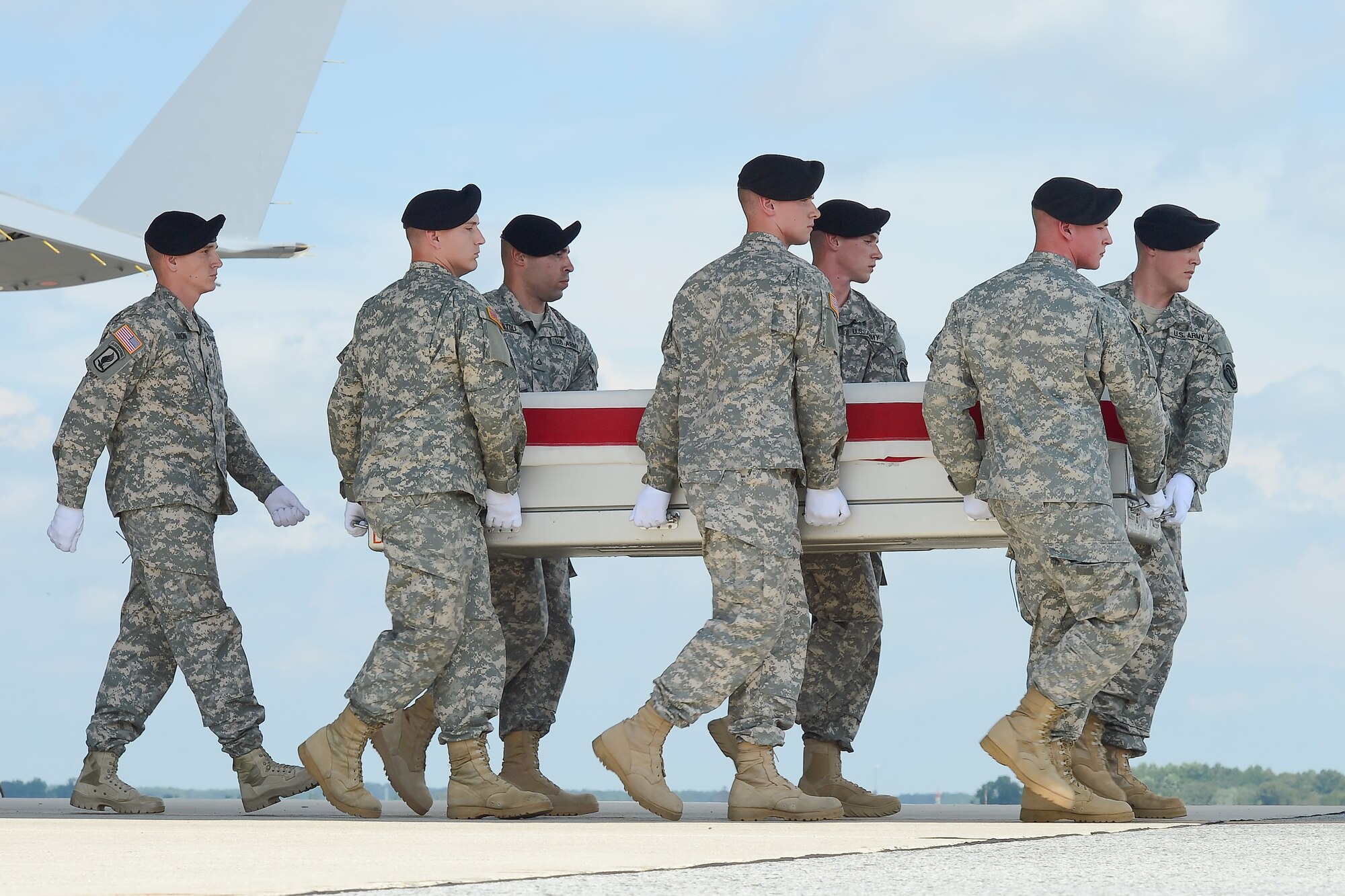 A U.S. Army carry team transfers the remains of Master Sgt. George A. Bannar Jr., of Orange, Va., during a dignified transfer Aug. 22, 2013 at Dover Air Force Base, Del. Bannar was assigned to Company C, 3rd Battalion, 3rd Special Forces Group, Fort Bragg, N.C. (U.S. Air Force photo/Greg L. Davis)