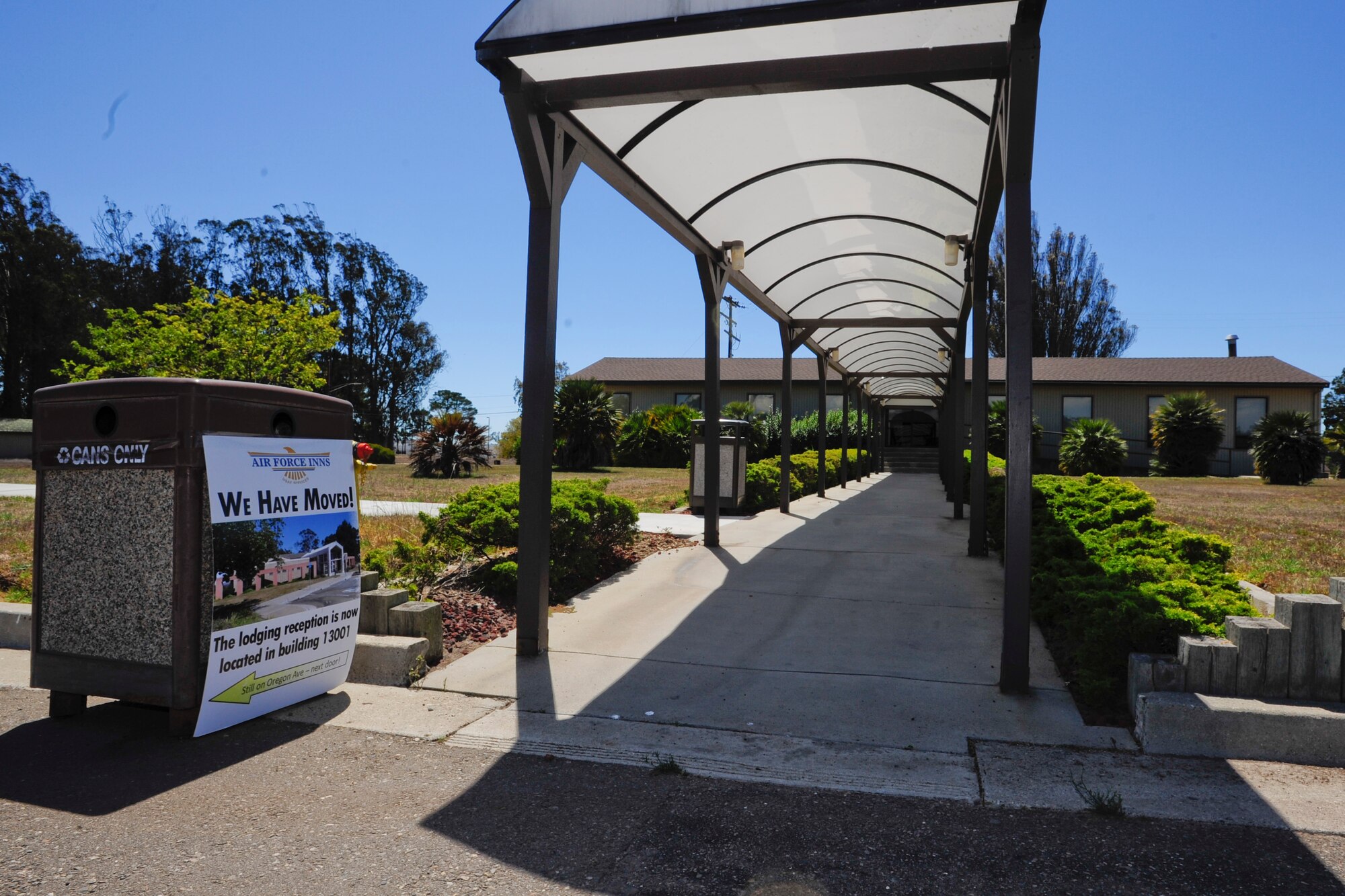 VANDENBERG AIR FORCE BASE, Calif. -- The previous Vandenberg Lodge office, originally built in 1942, is closed with a sign pointing to the new building prior to a ribbon cutting ceremony on Tuesday, August 20, 2013. The move to a new building, which has been in the making for the last few years, gives the Vandenberg Lodging center a bigger, brighter building and provides a better first impression for guests and customers. (U.S. Air Force photo/Airman Yvonne Morales)