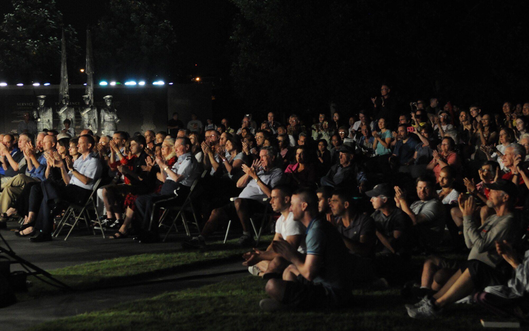 Audience members applaud after a performance by The United States Air Force Band in Washington, D.C., Aug. 16, 2013. More than 100 people attended the free concert held at The Air Force Memorial. (U.S. Air Force photo/Airman 1st Class Nesha Humes)