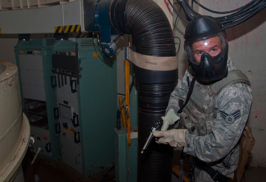 130814-F-BR137-433
Senior Airman Alec Griego, 790th Missile Security Forces Squadron, scours the inside of the Tango-09 Launch Facility for intruders during a training scenario Aug. 14, 2013. The scenario was part of an assaulter course meant to familiarize security forces and helicopter pilots with LF recapture scenarios. (U.S. Air Force photo by Airman 1st Class Jason Wiese)
