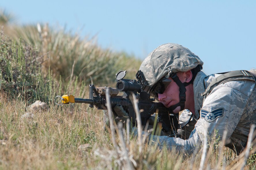 130814-F-BR137-291
Senior Airman Jordan Panknin, 790th Missile Security Forces Squadron, keeps an eye out for opposing forces Aug. 14, 2013, on a hill adjacent to the Tango-09 Launch Facility during a training course aimed at familiarizing security forces and helicopter pilots with launch facility recapture scenarios. The Tango-09 LF is a deactivated Peacekeeper ICBM LF the 620th Ground Combat Training Squadron uses for training scenarios involving LF recapture. (U.S. Air Force photo by Airman 1st Class Jason Wiese)