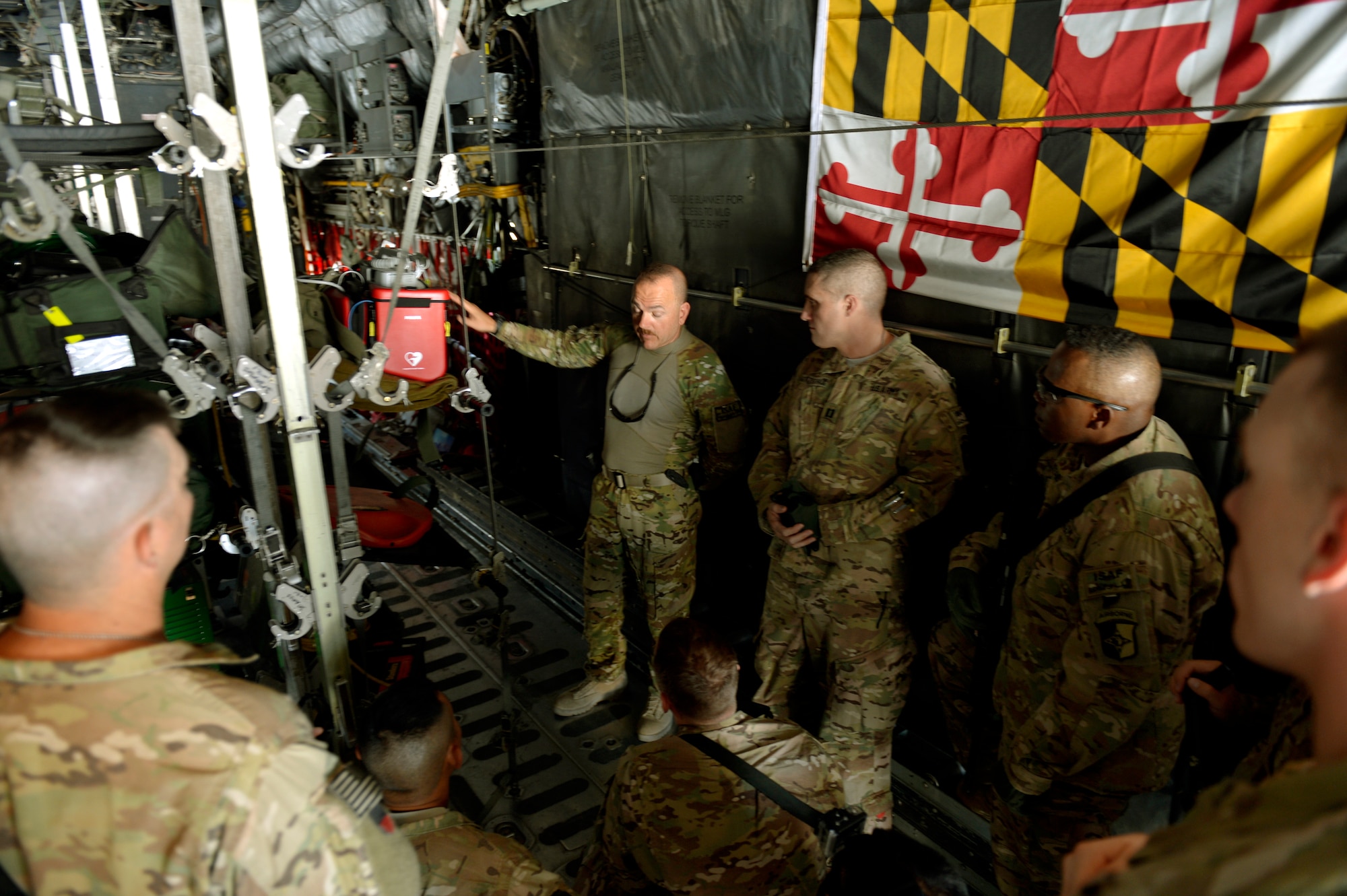 A 455th Expeditionary Aeromedical Evacuation Squadron technician teaches U.S. Army medics how to safely load onto a C-130 fixed aircraft at Bagram Airfield, Afghanistan, August, 22, 2013. The training will help Army medics better prepare patients for transfer. (U.S. Air Force photo/ Staff Sgt. Stephenie Wade)