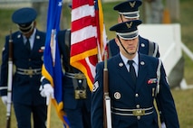 Members of the Minot Air Force Base Honor Guard prepare to present the colors during the 2013 North Dakota Peace Officer Association K-9 Police Trials at Minot AFB, N.D., Aug. 14, 2013. The competition brought police, military and security K-9 teams from around the state together in a friendly yet competitive environment. (U.S. Air Force photo/Senior Airman Brittany Y. Auld)