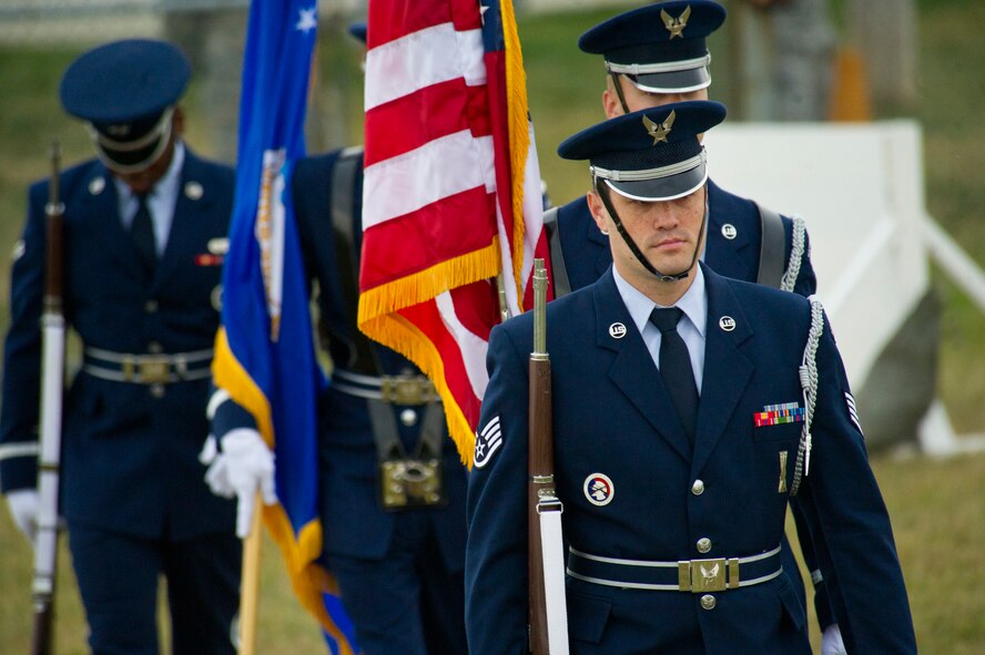 Members of the Minot Air Force Base Honor Guard prepare to present the colors during the 2013 North Dakota Peace Officer Association K-9 Police Trials at Minot AFB, N.D., Aug. 14, 2013. The competition brought police, military and security K-9 teams from around the state together in a friendly yet competitive environment. (U.S. Air Force photo/Senior Airman Brittany Y. Auld)