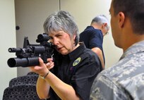 Megan Segal, a North Carolina Employer Support of the Guard and Reserve board member, aims an M-4 carbine during a weapons demonstration held by the 916th Security Forces Squadron. The ESGR board toured the wing during its mid-year meeting held at the 916th ARW headquarters.  (USAF photo by Maj. Erin Karl, 916ARW/PA)
