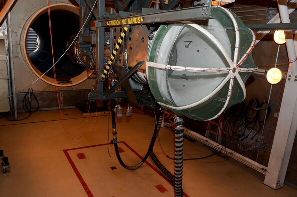 SPANGDAHLEM AIR BASE, Germany – An engine from an F-16 Fighting Falcon fighter aircraft sits in a cradle before a test run Aug. 21, 2013. During a test run of the engine, the propulsion flight checks for any leaks as well as monitor the vibrations of the engine. Fuel and oil leaks have to potential to cause external fires. (U.S. Air Force photo by Airman 1st Class Kyle Gese/Released)