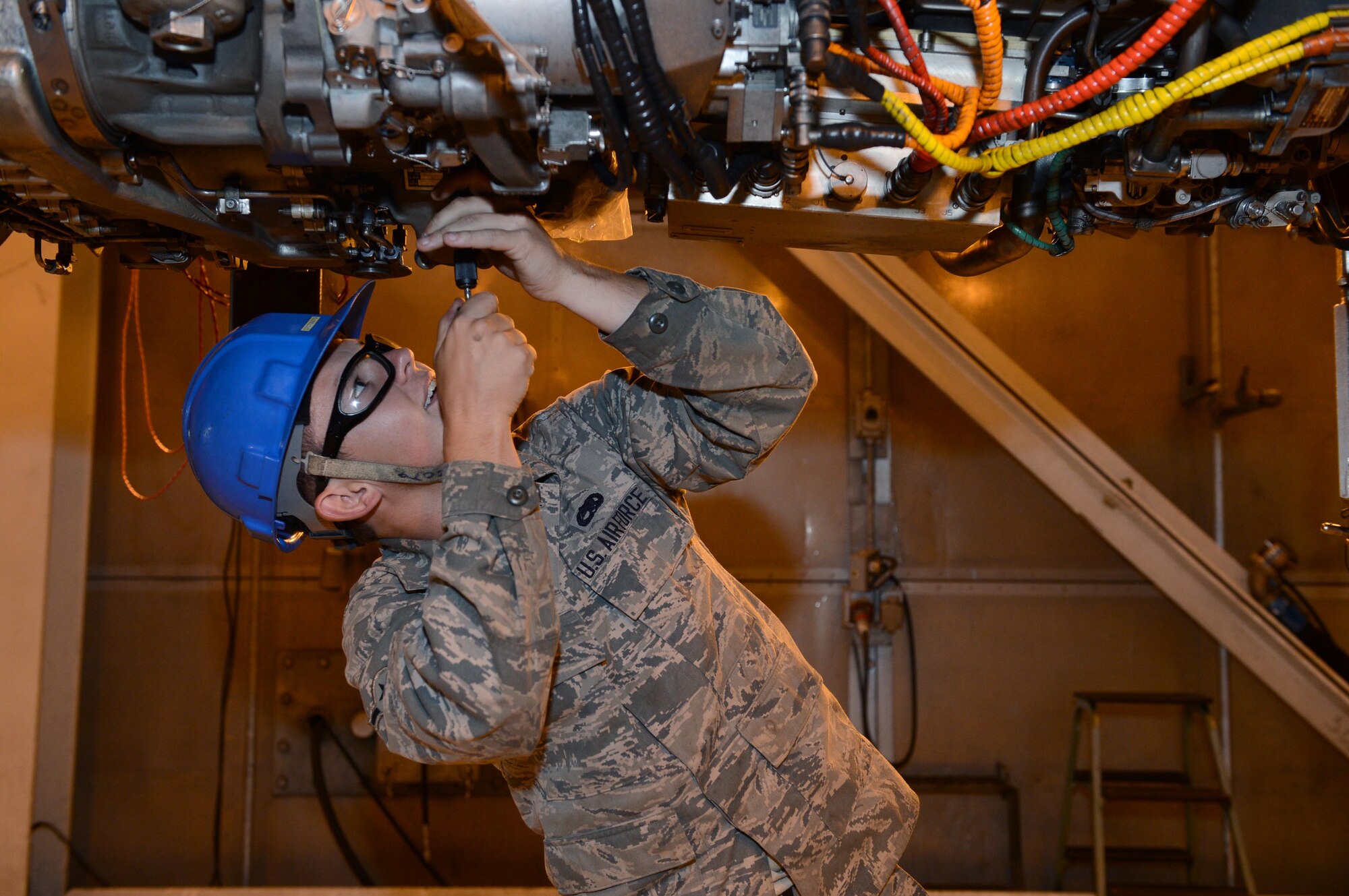 SPANGDAHLEM AIR BASE, Germany – U.S. Air Force Airman Jeremy Rushing, 52nd Component Maintenance Squadron aerospace propulsion technician from Charleston S.C., secures a filter with safety wire Aug. 8, 2013. The propulsion flight conducts stress tests on engines to make sure they can handle what pilots put them through. The F-16 fighting falcon fighter aircraft engine puts out 29,000 pounds of thrust. (U.S. Air Force photo by Airman 1st Class Kyle Gese/Released)