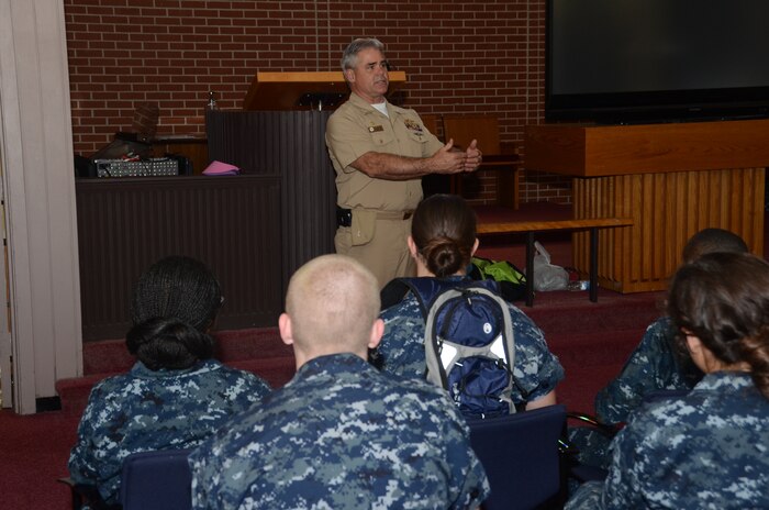 Joint Base Charleston Deputy Commander, Navy Capt. Timothy Sparks, speaks with 25 members of the U.S. Naval Sea Cadets, Hunley-Yorktown Division at the Good Shepherd Chapel at JB Charleston –Weapons Station, Aug. 10, 2013. The U.S. Navy provides mentors for the sea cadets, ages 10-17, and develops their skills by training in seagoing skills and instills values of patriotism, courage, self-reliance and other kindred virtues. (U.S. Navy photo/ Petty Officer 1st Class Chad Hallford)