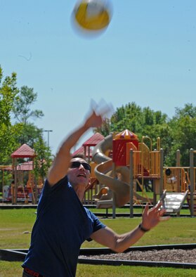 Airman 1st Class Richard Droddy, 5th Medical Operations Squadron mental health technician, plays a round of beach volleyball at Bud Ebert Park during the 5th Medical Group’s summer picnic, Aug. 16. The 5th MDG hosted a summer picnic for its personnel to boost morale and camaraderie between the various group agencies. The 5th MDG staff is often at the forefront of resiliency training during Team Minot’s Wingman Days and often times do not get to take part in team building exercises for their own units. A summer picnic serves as a way for the 5th MDG to come together as a team and show support for one another. (U.S. Air Force photo/Senior Airman Jose L. Hernandez) 