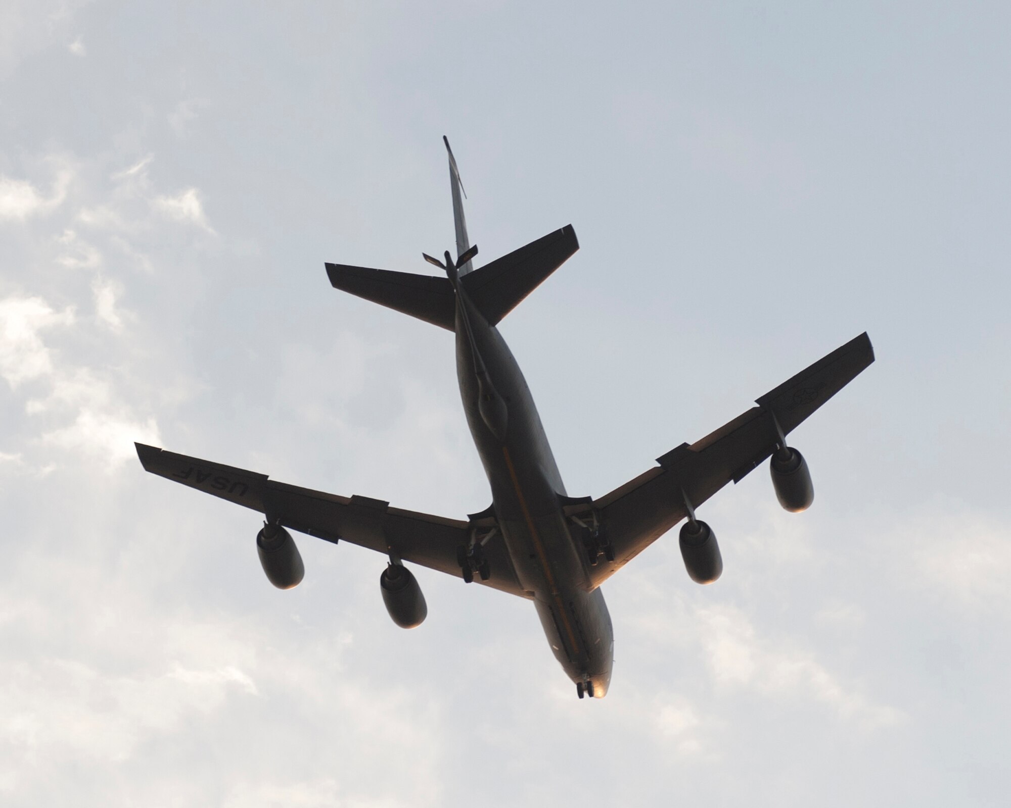 A KC-135 Stratotanker flies over the flightline as it prepares to circle and land at Transit Center at Manas, Kyrgyzstan, August 22, 2013. The KC-135 aircraft is made of more than 50 percent aluminum by weight, and 10 percent steel and stainless steel, among other materials. (U.S. Air Force photo/Staff Sgt. Robert Barnett)