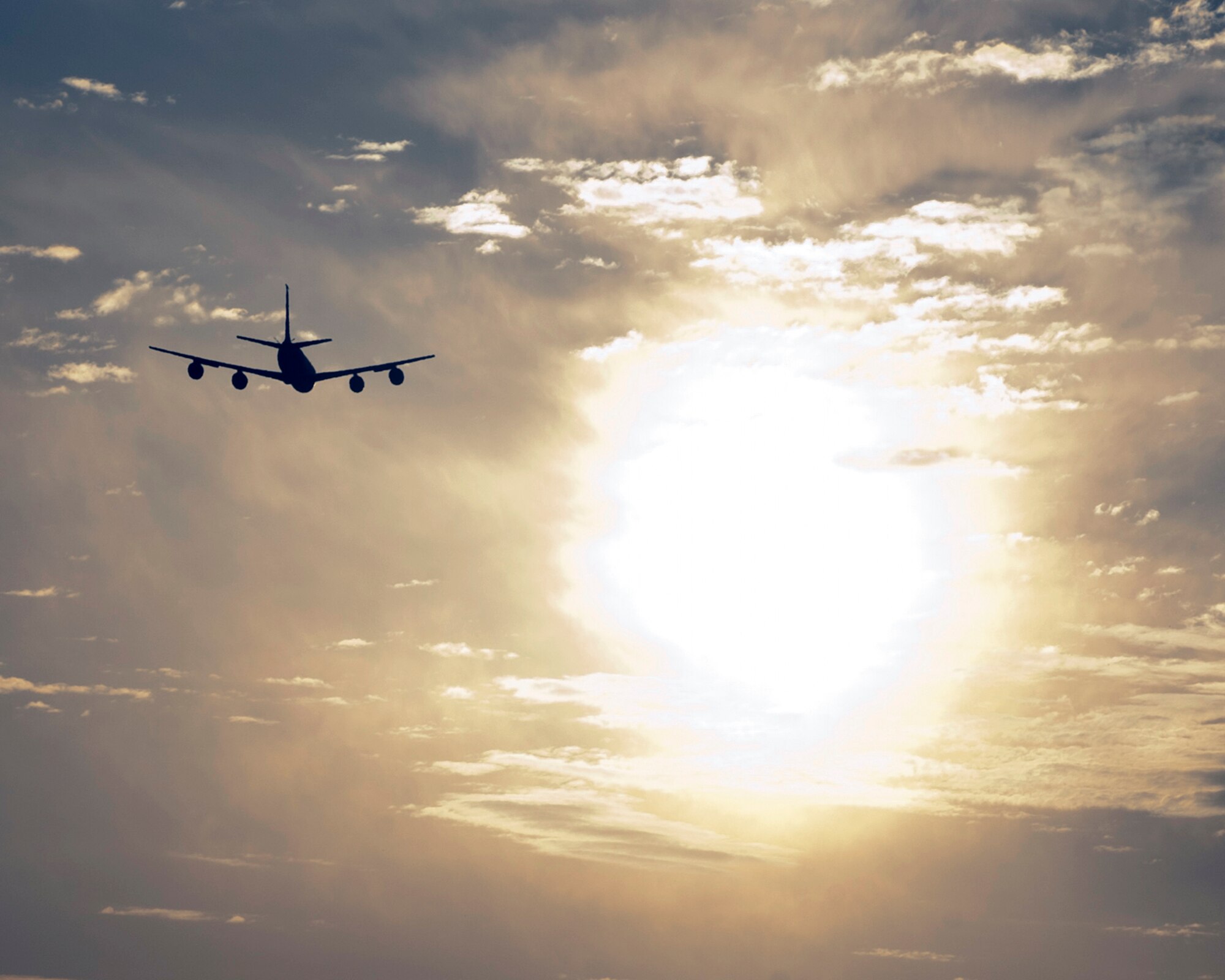 A KC-135 Stratotanker hurtles into the morning sun over Transit Center at Manas, Kyrgyzstan, August 22, 2013. The KC-135 transfers more fuel in eight minutes than a gas station could pump in 24 hours. (U.S. Air Force photo/Staff Sgt. Robert Barnett)