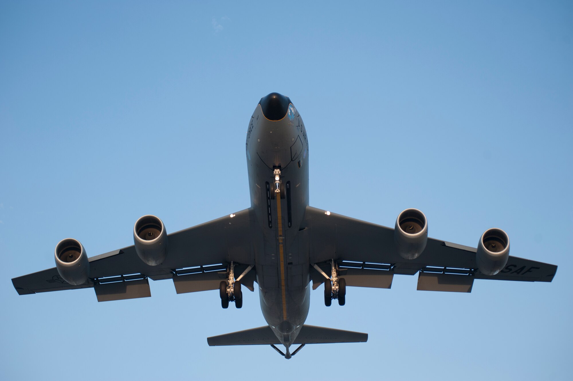 A KC-135 Stratotanker lowers its landing gear prior to touching down at Transit Center at Manas, Kyrgyzstan, August 22, 2013. The KC-135 is capable of towing a fighter jet while hooked up for a refueling at 500 miles per hour. (U.S. Air Force photo/Staff Sgt. Robert Barnett)