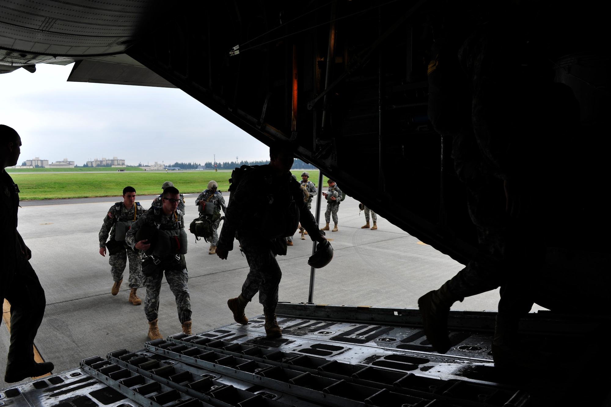 U.S. Army airborne troops board a C-130 Hercules Aug. 22, 2013, during jump training at Yokota Air Base, Japan. The Soldiers are assigned to the 1st Battalion, 1st Special Forces Group. (U.S. Air Force photo by Senior Airman Cody H. Ramirez)