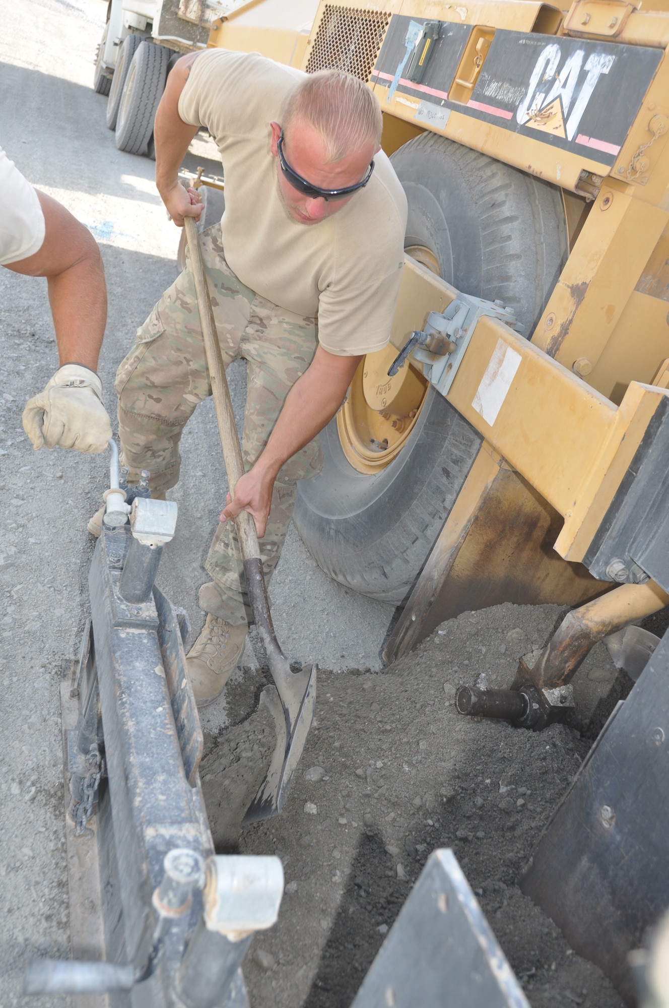 Staff Sgt. Travis Woody, 557th RED HORSE Squadron, is deployed from Malmstrom Air Force Base, Mont., and a native of Roan Mountain, Tenn., is working on the perimeter flightline road construction project at Bagram Airfield, Afghanistan, Aug. 19. The project is scheduled to be completed by the end of August. (U.S. Air Force photo/Tech. Sgt. Rob Hazelett)