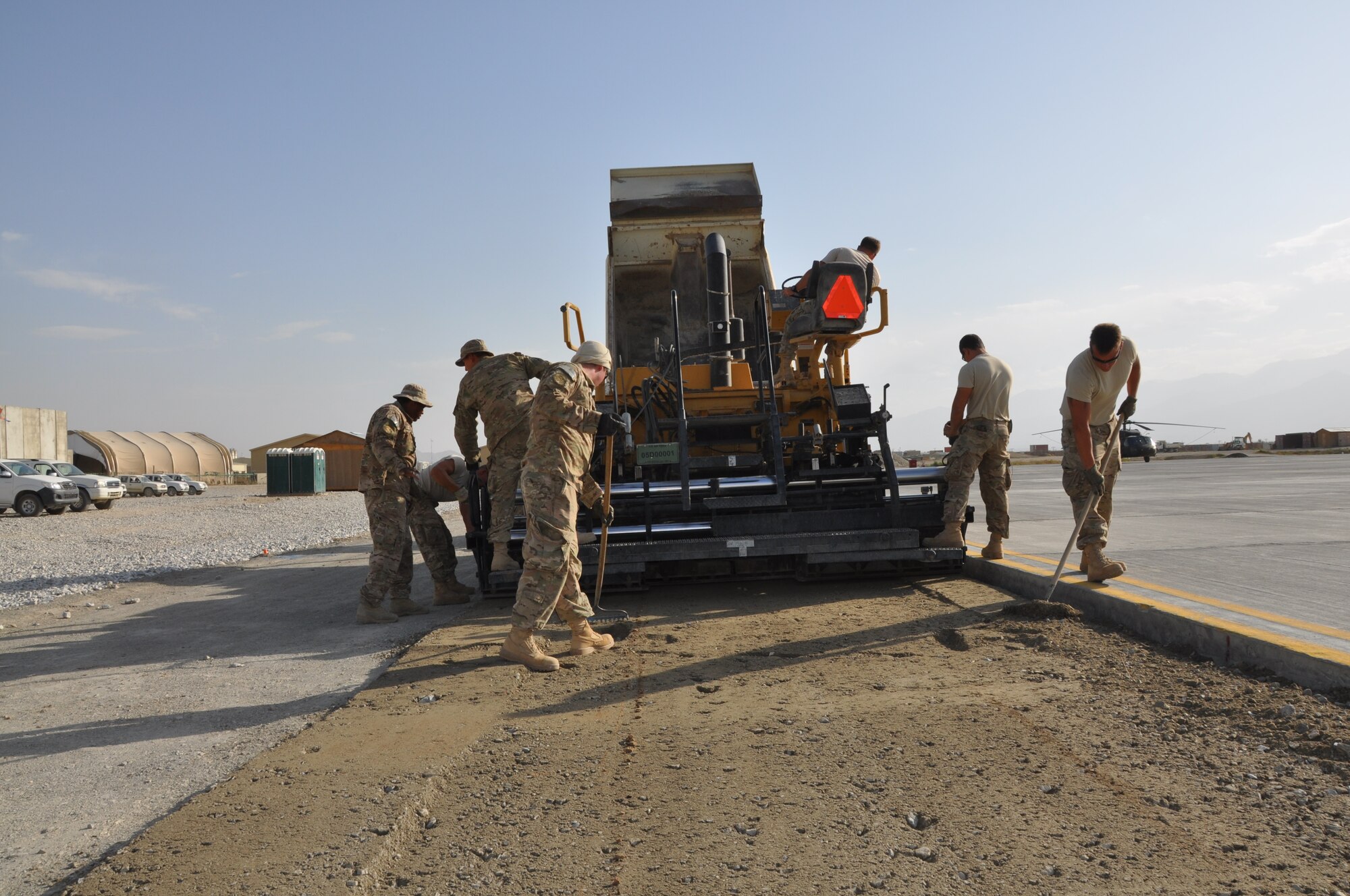 Airmen from the 557th RED HORSE Squadron, deployed from Malmstrom Air Force Base, Mont., are working on the perimeter flightline road construction project at Bagram Airfield, Afghanistan, Aug. 19. The project is scheduled to be completed by the end of August. (U.S. Air Force photo/Tech. Sgt. Rob Hazelett)