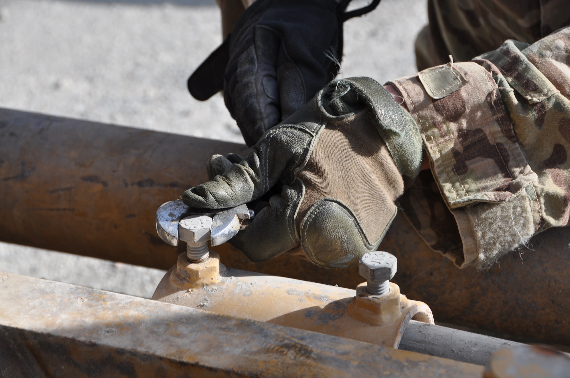 An Airman from the 557th RED HORSE Squadron, deployed from Malmstrom Air Force Base, Mont., is working on the perimeter flightline road construction project at Bagram Airfield, Afghanistan, Aug. 19. The project is scheduled to be completed by the end of August. (U.S. Air Force photo/Tech. Sgt. Rob Hazelett)