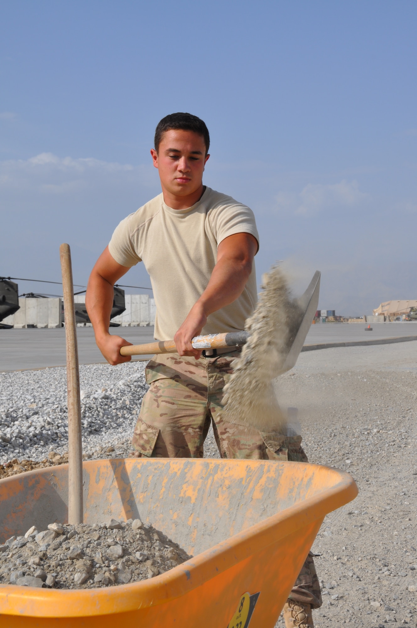 Airman 1st Class Juan Rigioni, 557th RED HORSE Squadron, is deployed from Malmstrom Air Force Base, Mont., and a native of Dallas, is working on the perimeter flightline road construction project at Bagram Airfield, Afghanistan, Aug. 19. The project is scheduled to be completed by the end of August. (U.S. Air Force photo/Tech. Sgt. Rob Hazelett)