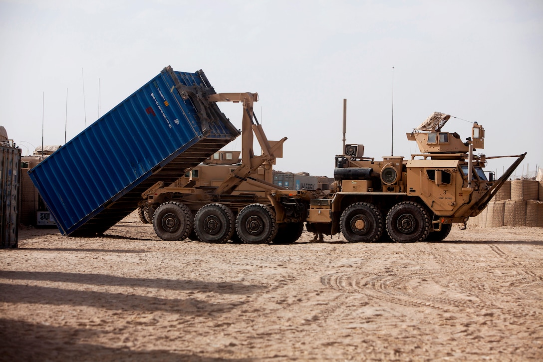 A U.S. Marine Corps logistics vehicle system replacement delivers an international shipping container, which is used for hauling large quantities of cargo, to the service members on Combat Outpost Eredvi in Helmand province, Afghanistan, Aug. 13, 2013.