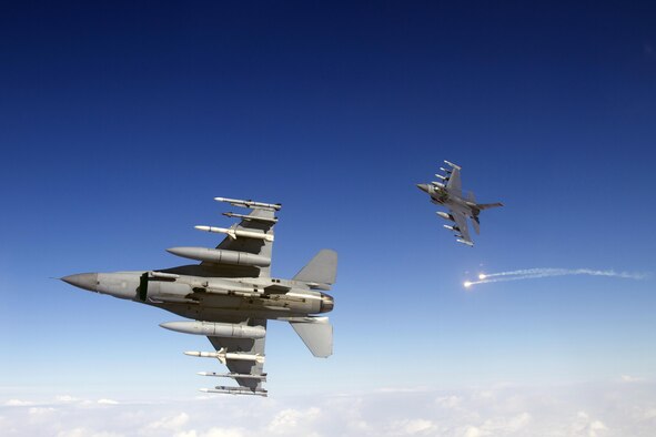 Two U.S. Air Force F-16 Fighting Falcons from the 35th Fighter Wing conduct Suppression of Enemy Air Defense training over Misawa Air Base, Japan, Feb. 14, 2013. Pilots at Misawa received a Joint Deployable Electronic Warfare Range to be placed at Draughon Range, an area located only 10 nautical miles north of the base where pilots are authorized to drop live ordnance during training.