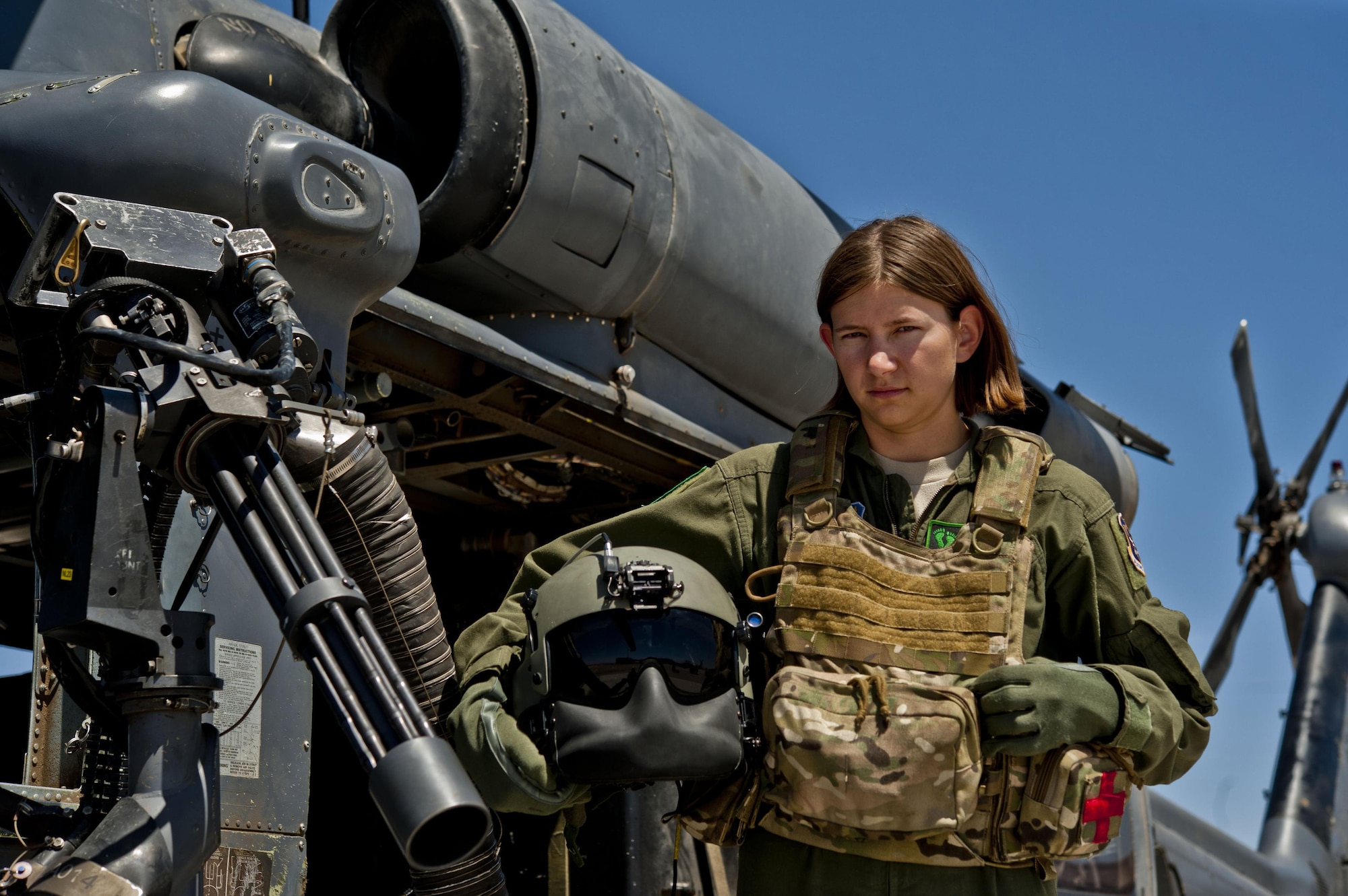 Airman 1st Class Natasha Libby, 66th Rescue Squadron aerial gunner, stands next to an HH-60 Pave Hawk June 20, 2013, at Nellis Air Force Base, Nev. Libby is the only female among more than 30 gunners assigned to the 66th RQS.