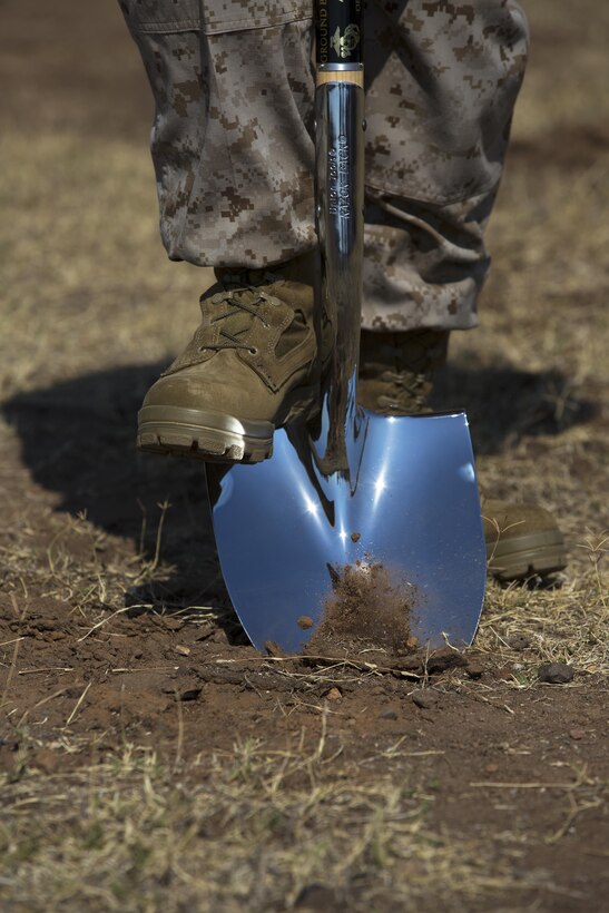 Cpl. Mark Willoughby Jr., an air command and control electronics operator with Marine Tactical Air Command Squadron 38 and an Artesia, Calif. native breaks ground during a ceremony for a long-awaited obstacle course aboard Marine Corps Air Station Miramar, Calif. Aug. 22. Within days of Willoughby asking the 3rd Marine Aircraft Wing commanding general why this instillation did not have an obstacle course, Marine Wing Support Squadron 373 was tasked with building the first one here.
