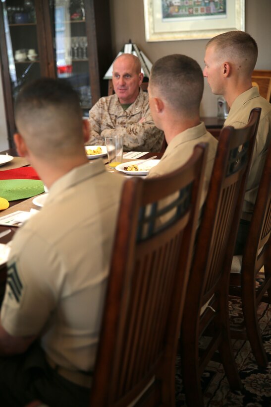 Maj. Gen. Steven Busby, the commanding general of 3rd Marine Aircraft Wing, speaks with noncommissioned officers with Marine Unmanned Aerial Vehicle Squadron 3 at his house during a breakfast held aboard Marine Corps Air Station Miramar, Calif., Aug. 22. VMU-3 is one of the few units aboard Marine Corps Air Ground Combat Center Twentynine Palms that are part of the air wing.