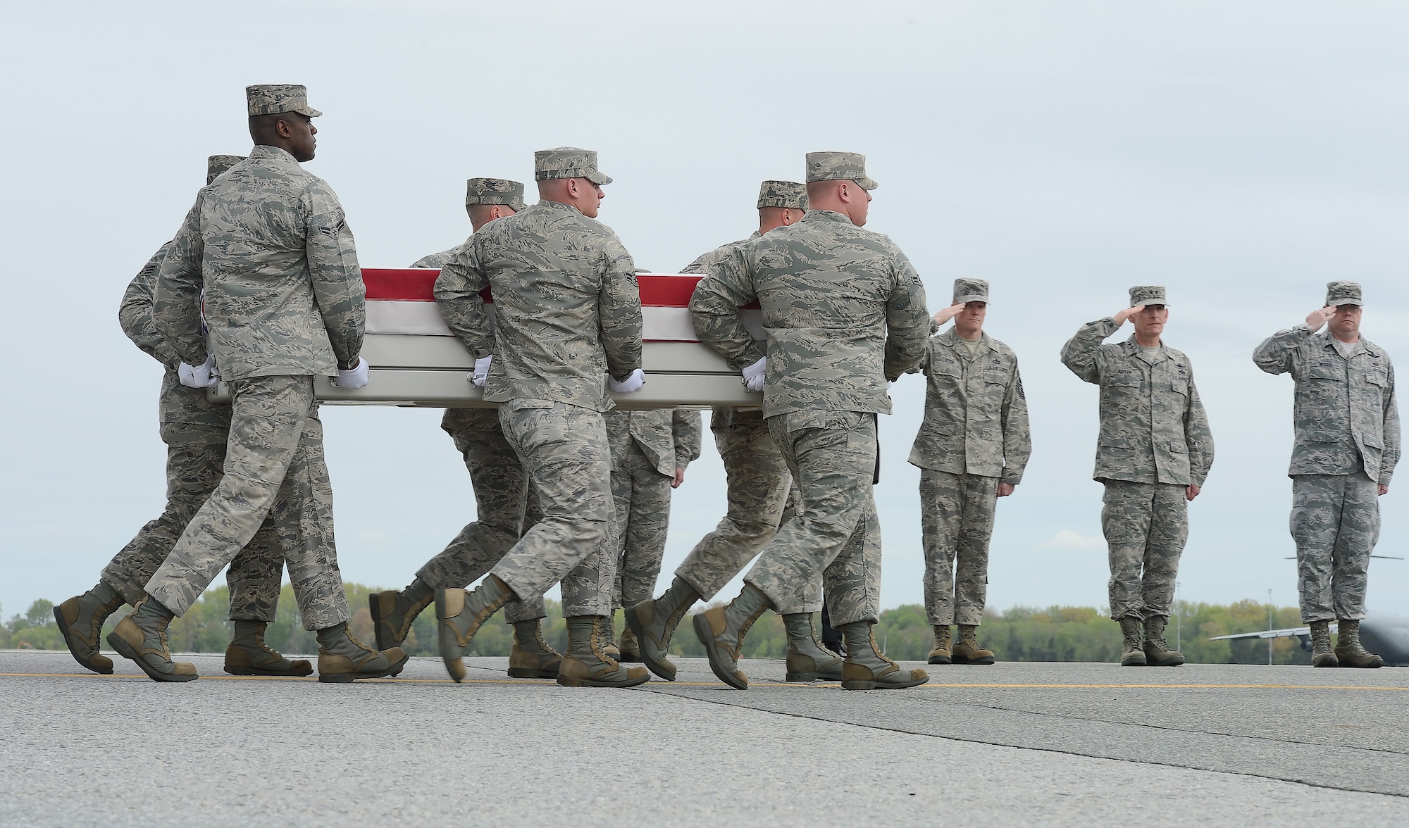 A carry team transfers the remains of Capt. Reid K. Nishizuka, of Kailua, Hawaii, during a dignified transfer, April 30, 2013, at Dover Air Force Base, Del. Nishizuka was assigned to the 427th Reconnsassance Squadron, Beale AFB, Calif. 