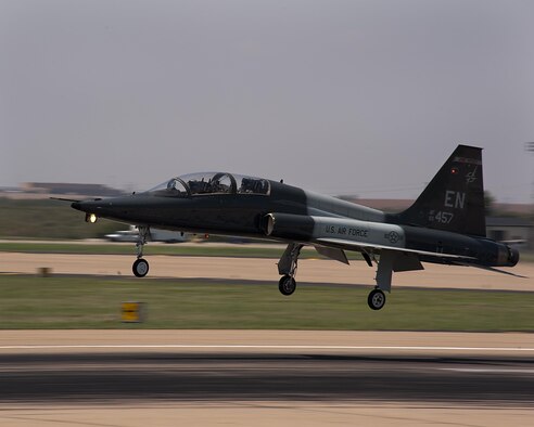 Pilots practice touch-and-go maneuvers in a T-38 Talon during training Aug. 21, 2013, at Sheppard Air Force Base, Texas. The Talon is a two-seat, twin-engine supersonic jet trainer used to train pilots in the international Euro-NATO Joint Pilot Training Program. The pilots are assigned to the 80th Flying Training Wing. (U.S. Air Force photo/Danny Webb)
