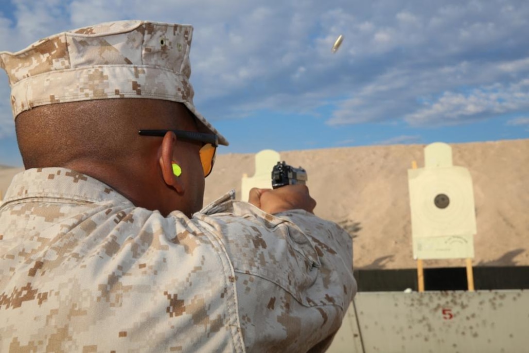 Lance Cpl. Luis Castro, a legal clerk with Marine Corps Logistics Base Barstow, fires downrange during a M9 pistol pre-qualification at the base’s rifle and pistol range, Aug. 22. The base offers more than 2,400 acres to units in the southwest region. It also houses a 1,000-yard rifle range as well as a pistol and shotgun range.  The ranges provide sustainment and qualification training for service members and provide a unique environment for local law enforcement agencies to hone their skills. 