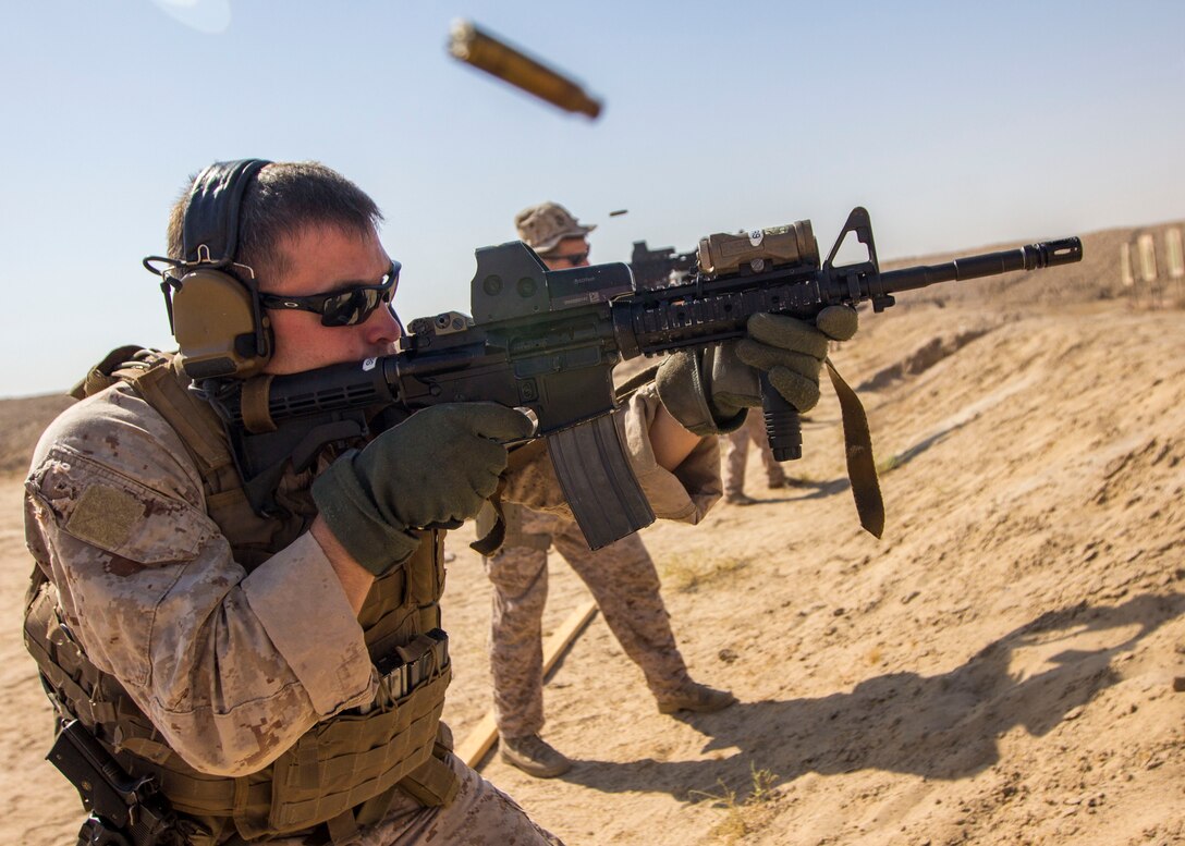 A U.S. Marine assigned to Force Reconnaissance Platoon, Maritime Raid Force, 26th Marine Expeditionary Unit (MEU), engages targets with an M4 Carbine during an advanced marksmanship range in the 5th Fleet area of responsibility, Aug. 19, 2013. The Marines conducted the range in 115 degree heat with a full combat load to acclimate themselves to harsh desert environments. The 26th MEU is a Marine Air-Ground Task Force forward-deployed to the U.S. 5th Fleet area of responsibility aboard the Kearsarge Amphibious Ready Group serving as a sea-based, expeditionary crisis response force capable of conducting amphibious operations across the full range of military operations. (U.S. Marine Corps photo by Sgt. Christopher Q. Stone, 26th MEU Combat Camera/Released)