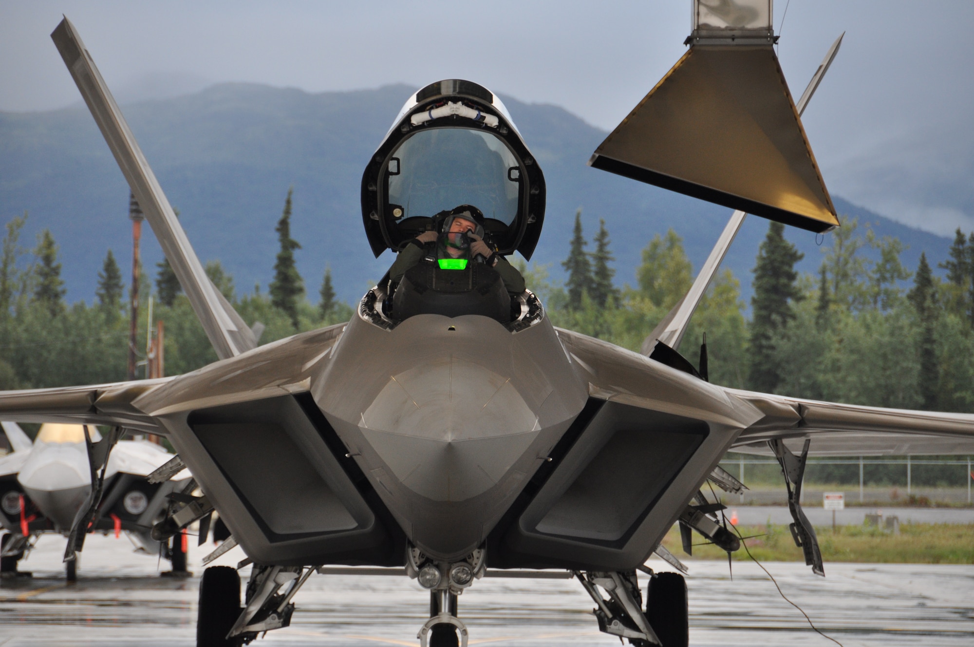Maj. Jonathan Gration, Reserve F-22 pilot assigned to the 302nd Fighter Squadron and  prepares to fly a Red Flag Alaska sortie here August 23. Gration splits his time between flying the F-22 for Alaska’s only Air Force Reserve unit and an MD-11 for FedEx (U.S. Air Force/Tech. Sgt. Dana Rosso)