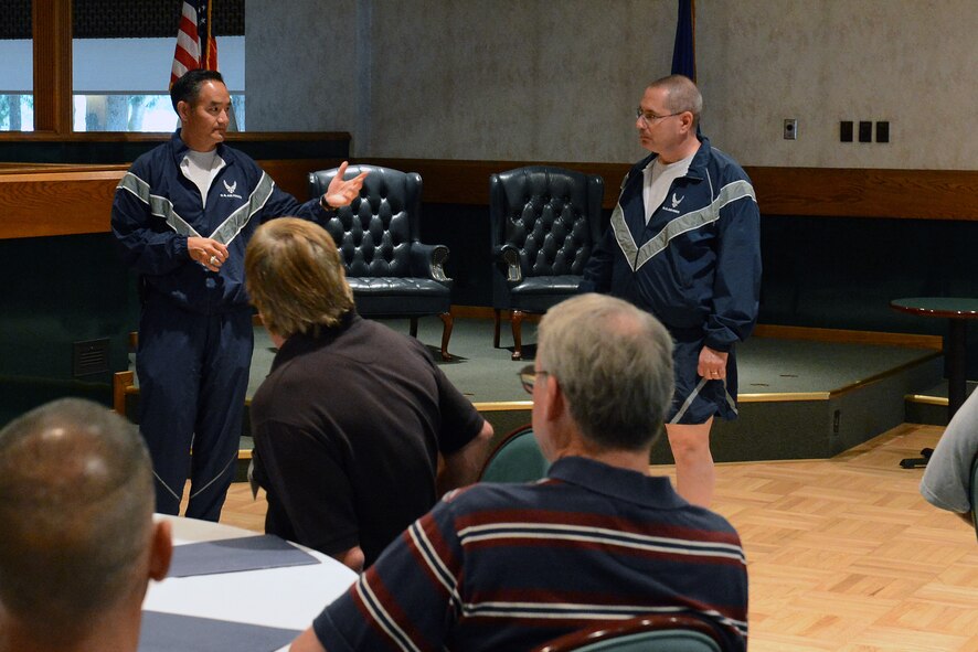 Col. David Kumashiro, 62nd Airlift Wing commander introduces civic leaders to Col. James Moeller, 62nd Medical Squadron commander, at the all ranks club Aug. 23, 2013 prior to the Team McChord Sports Day kickoff at Joint Base-Lewis McChord, Wash. More than 15 civic leaders visited McChord and participated with Airmen in the annual Sports Day event.  (U.S. Air Force photo/Airman 1st Class Jacob Jimenez)