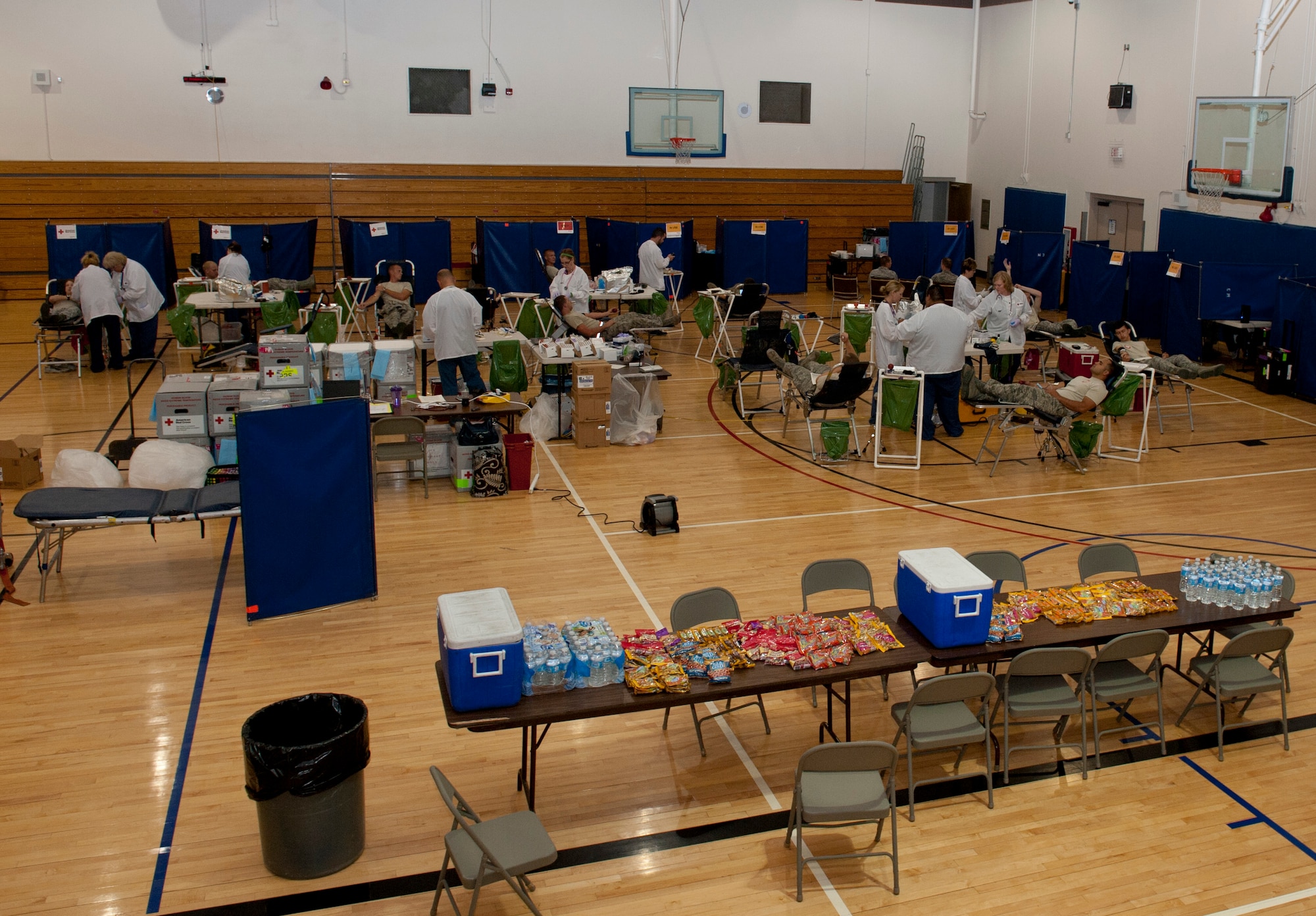 U.S. Air Force Airmen donate blood Aug. 22, 2013, at Mountain Home Air Force Base, Idaho. MHAFB regularly donates blood to the American Red Cross meeting or exceeding 100 pints every blood drive. (U.S. Air Force photo by Airman 1st Class Brittany A. Chase/Released)