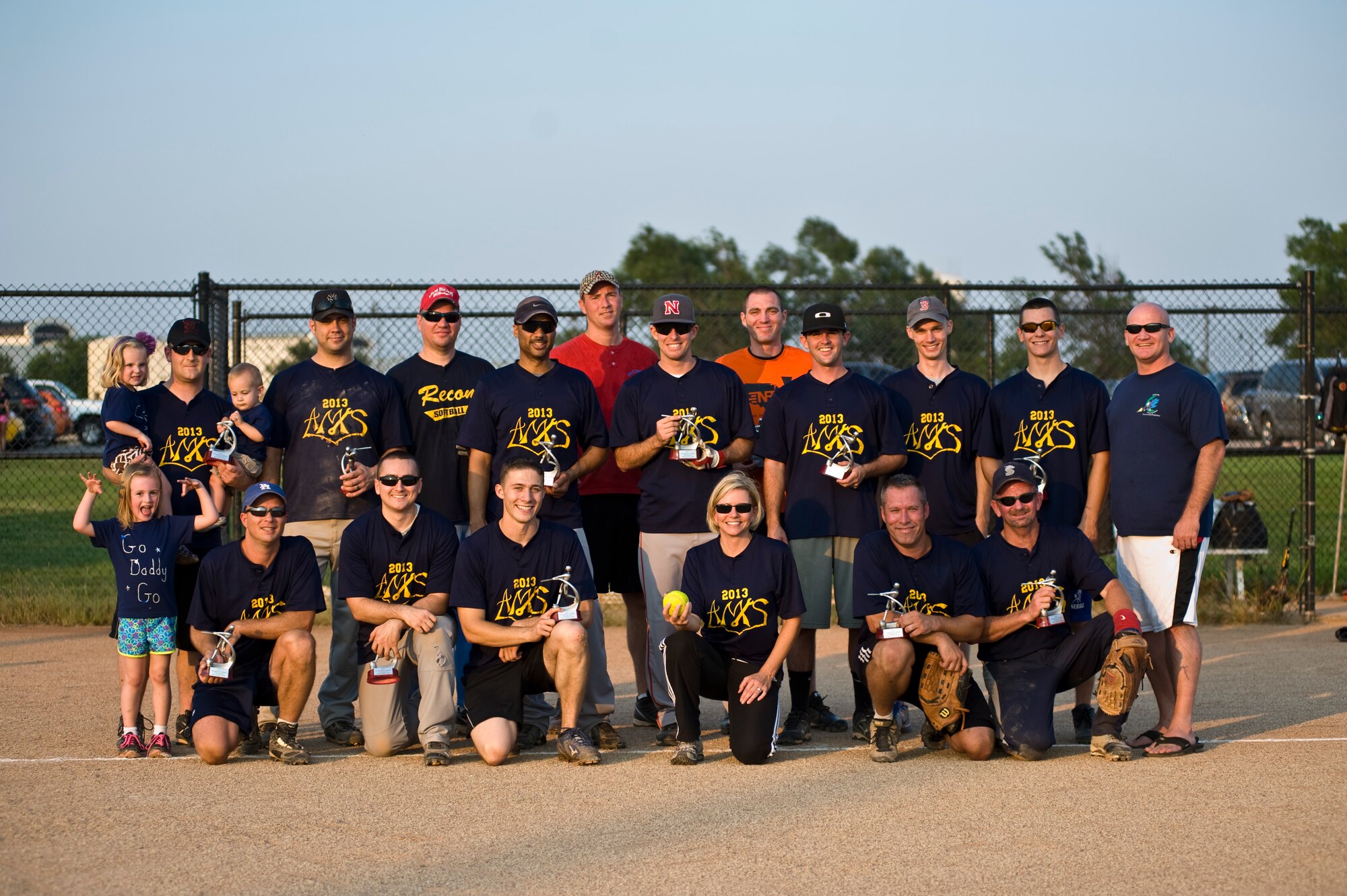 Members of the 22nd Aircraft Maintenance Squadron pose with their trophies after winning the base intramural softball championship Aug. 21, 2013, at McConnell Air Force Base Kan. The 22nd AMXS team ended the season defeating the 22nd Maintenance Squadron team, 10-4. (U.S. Air Force photo/Airman 1st Class John Linzmeier) 