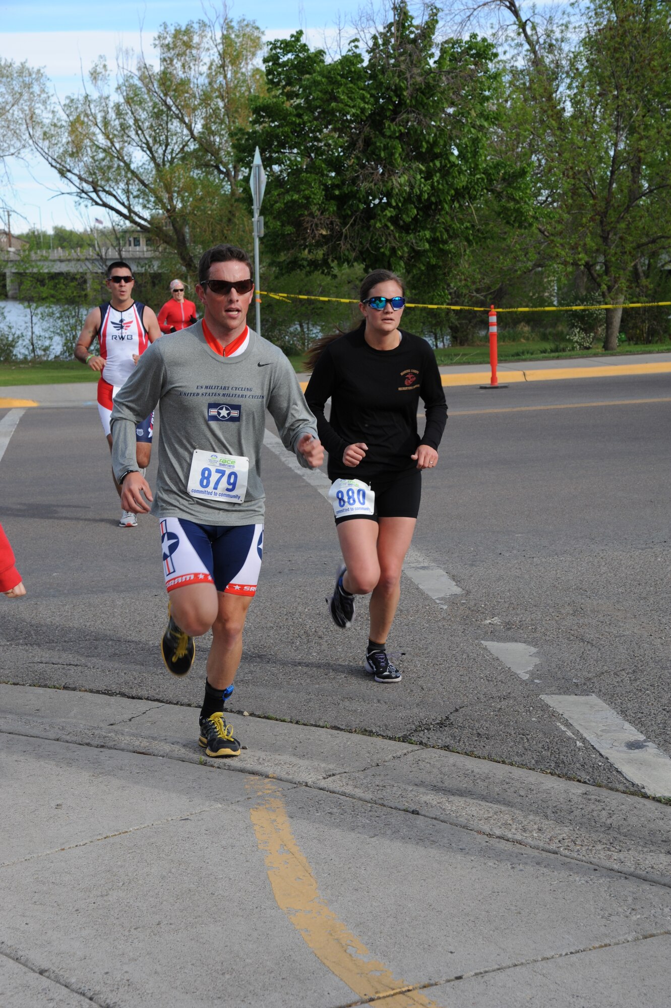 1st Lt. Mark Taylor, 490th Missile Squadron ICBM combat crew commander, and his wife, Toni, near the end of the running portion of Scheel’s Red White and Blue duathalon in Great Falls, Mont., on May 25. Taylor has been a member of the U.S. Military Cycling Team since 2012 and competes in road racing, stage racing, criteriums and time trials throughout the northwest. (U.S. Air Force photo/Senior Airman Katrina Heikkinen) 