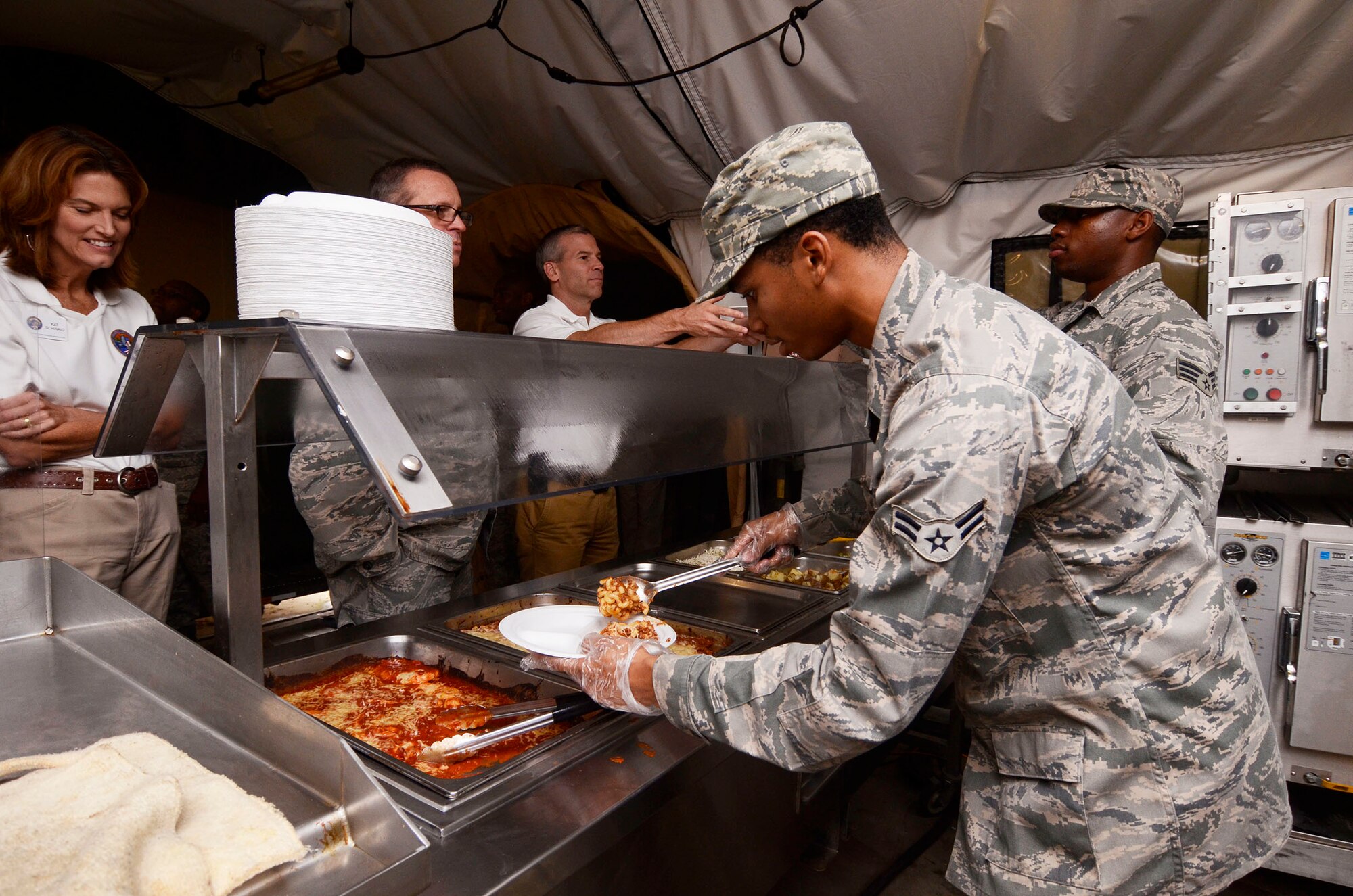 Local Honorary Commanders Association members were treated to lunch by students attending the Force Support Combat Training Center during a tour of Dobbins Air Reserve Base, Ga. Aug 21.  Dobbins Day program HCA attendees  experienced additional base sites including a realistic aircraft fire demonstration, Eastern Regional C-130 Hercules Flight Simulator,  base operations, weather station and air traffic control tower, as well as static displays by an Explosive Ordnance Disposal team, C-130 Hercules air crews and briefings from 94th Aeromedical Evacuation Squadron personnel. (U.S. Air Force photo/Don Peek)