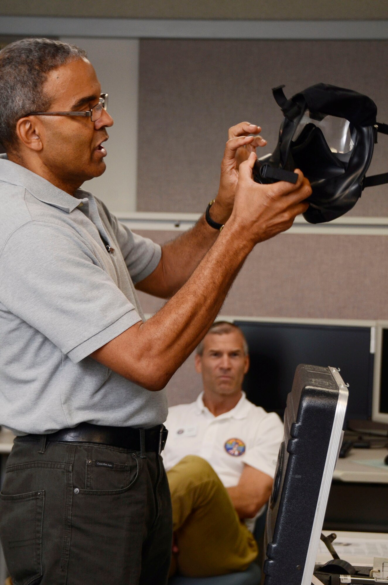 Local Honorary Commanders Association members receives a demonstration of chemical defense equipment during a tour of Dobbins Air Reserve Base, Ga. Aug 21.  Dobbins Day program HCA attendees  experienced additional base sites including a realistic aircraft fire demonstration, Eastern Regional C-130 Hercules Flight Simulator, Force Support Combat Training Center, base operations, weather station and air traffic control tower, as well as static displays by an Explosive Ordnance Disposal team, C-130 Hercules air crews and briefings from 94th Aeromedical Evacuation Squadron personnel. (U.S. Air Force photo/Don Peek)