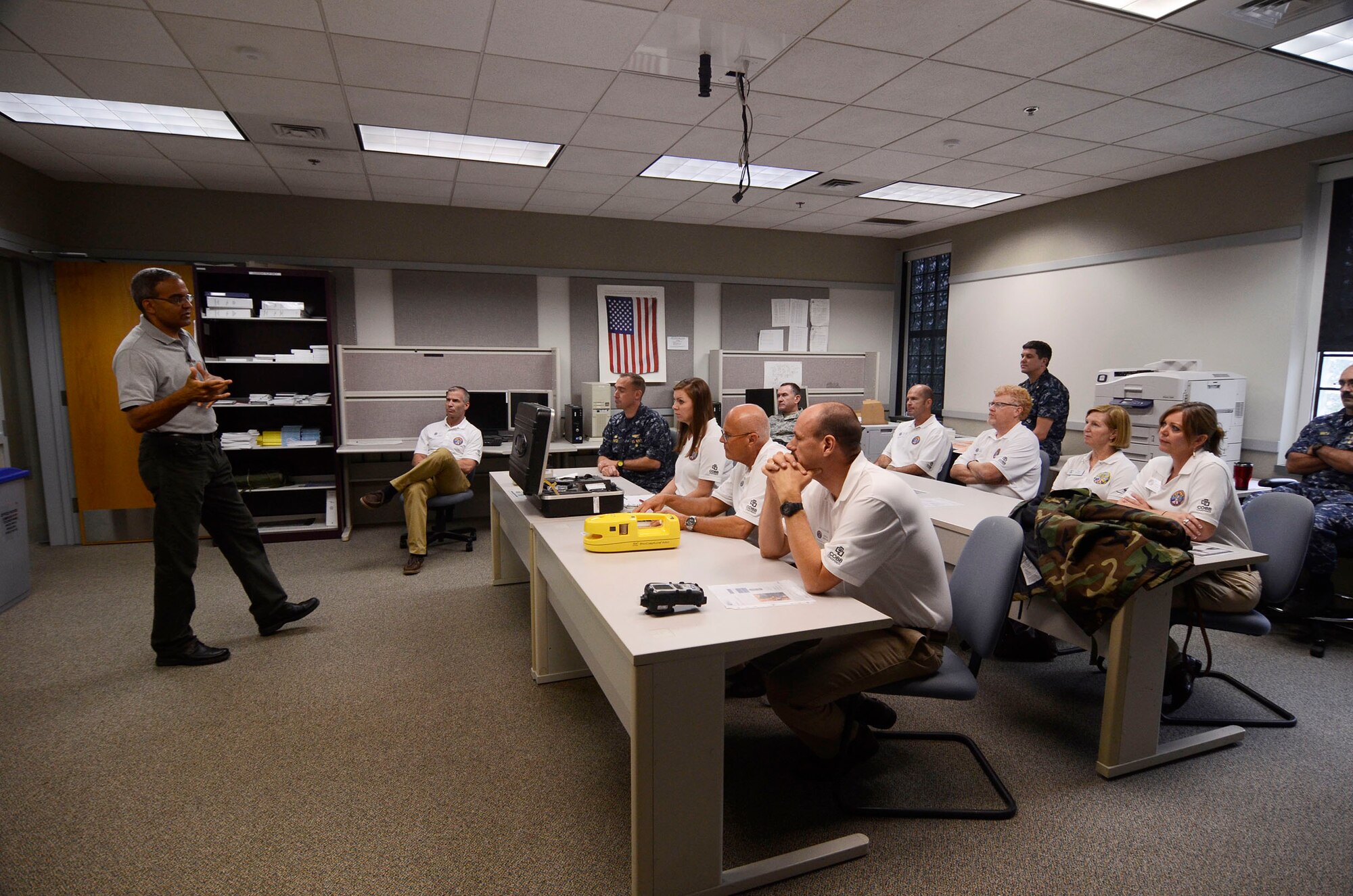 Local Honorary Commanders Association members receives a demonstration of chemical defense equipment during a tour of Dobbins Air Reserve Base, Ga. Aug 21.  Dobbins Day program HCA attendees  experienced additional base sites including a realistic aircraft fire demonstration, Eastern Regional C-130 Hercules Flight Simulator, Force Support Combat Training Center, base operations, weather station and air traffic control tower, as well as static displays by an Explosive Ordnance Disposal team, C-130 Hercules air crews and briefings from 94th Aeromedical Evacuation Squadron personnel. (U.S. Air Force photo/Don Peek)